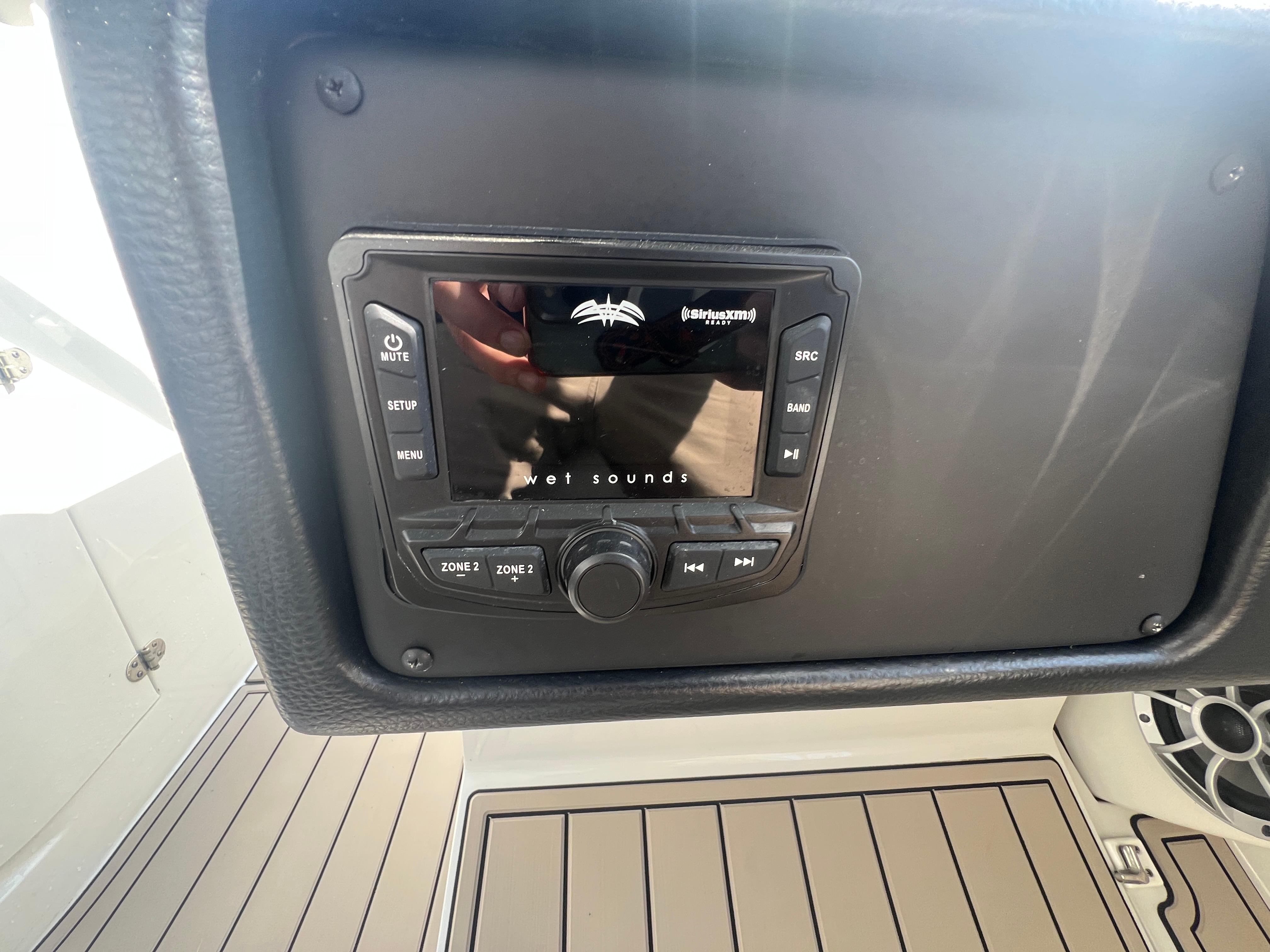 Control panel of 2023 Finseeker 280 DC boat with audio system.