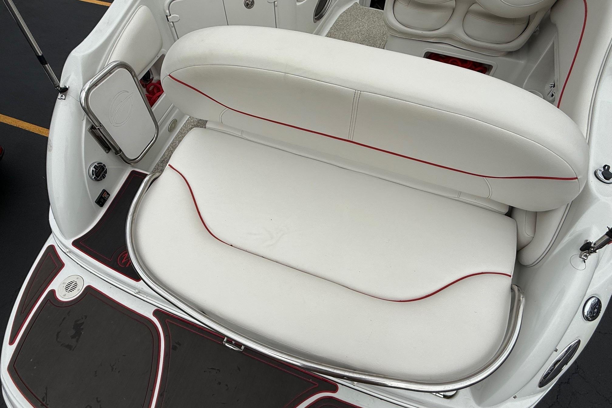2005 Crownline 250 CR boat interior with white seating and red accents.