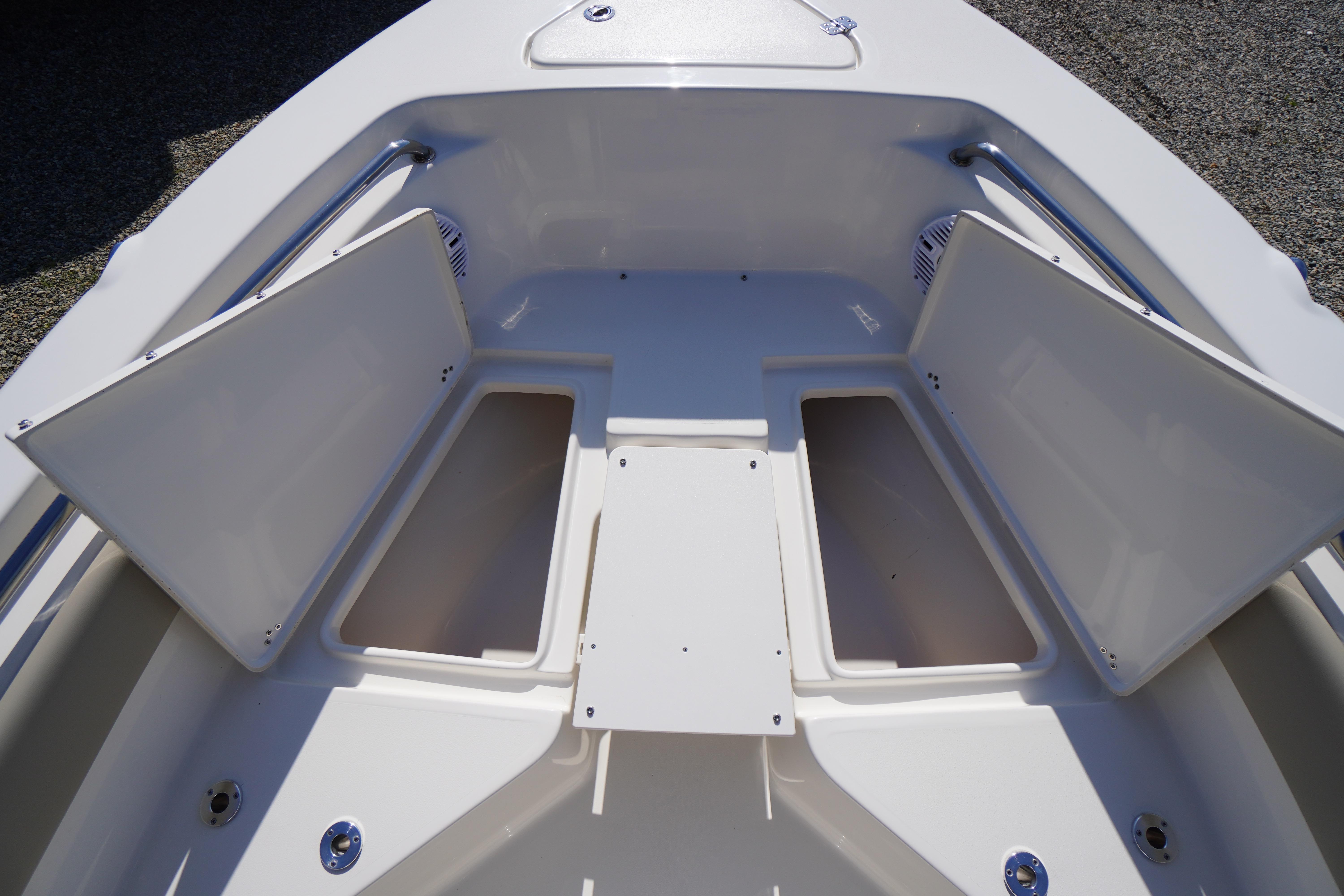 2025 Key West 203 FS boat storage compartments open, showcasing spacious design.