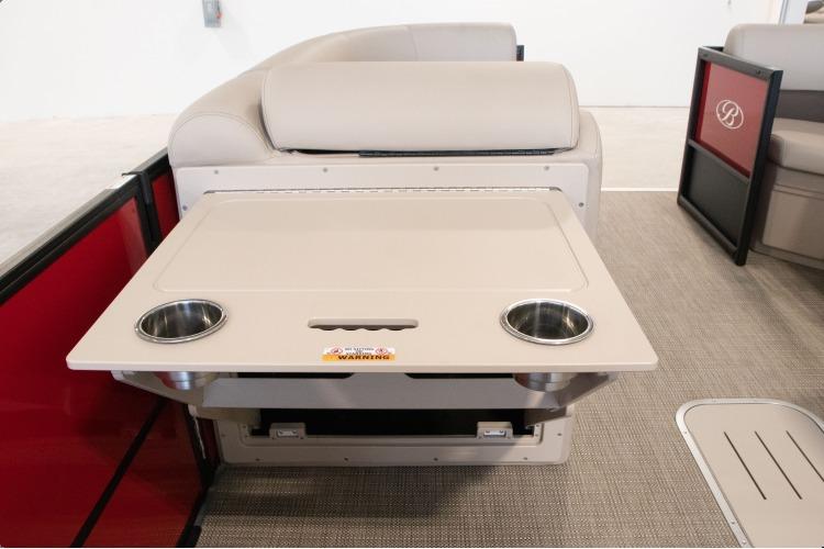 Interior of 2026 Bentley Pontoons Legacy 243 Navigator Ext with foldable table and cup holders.