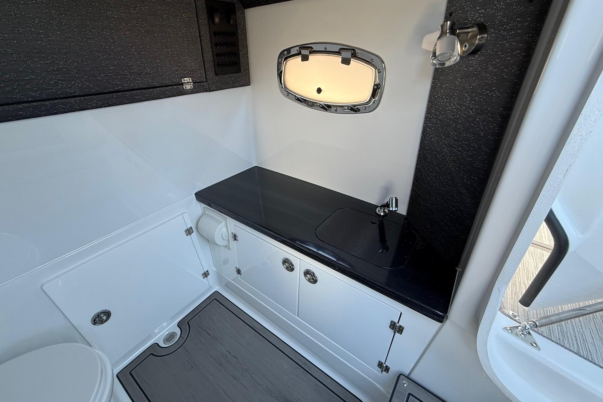 Interior of 2026 Monterey Elite 30 OB with sink and window.