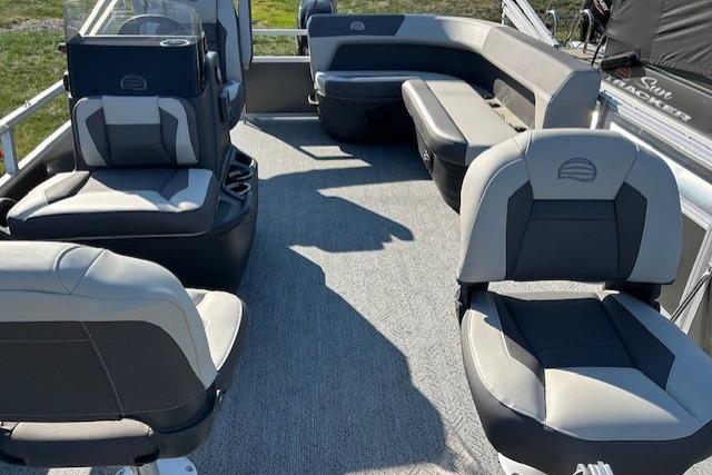 2026 Sun Tracker Bass Buggy 16 XL Select pontoon boat interior with gray seating and carpet.