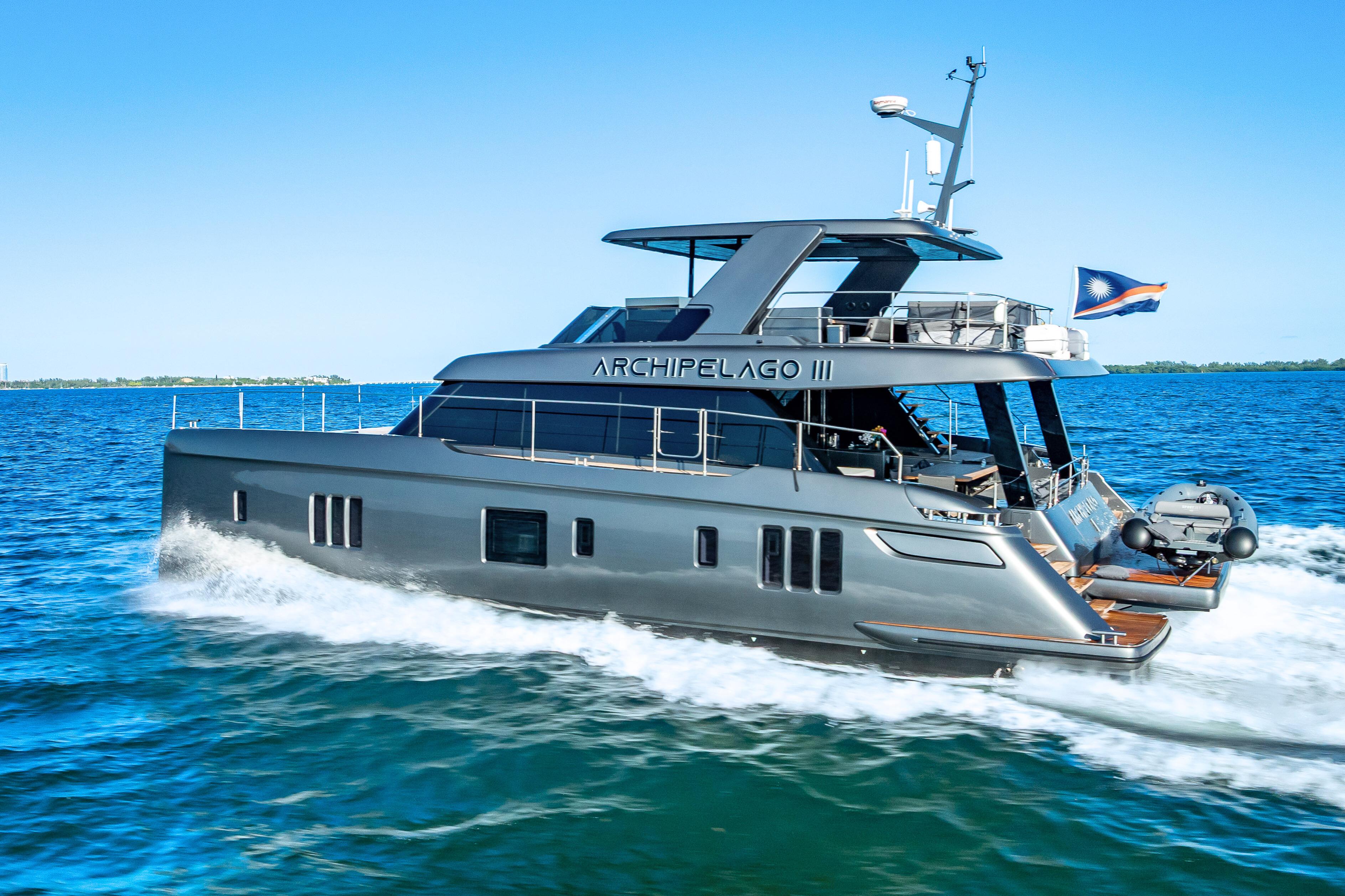 2026 Sunreef 60 Power yacht cruising on blue ocean waters.