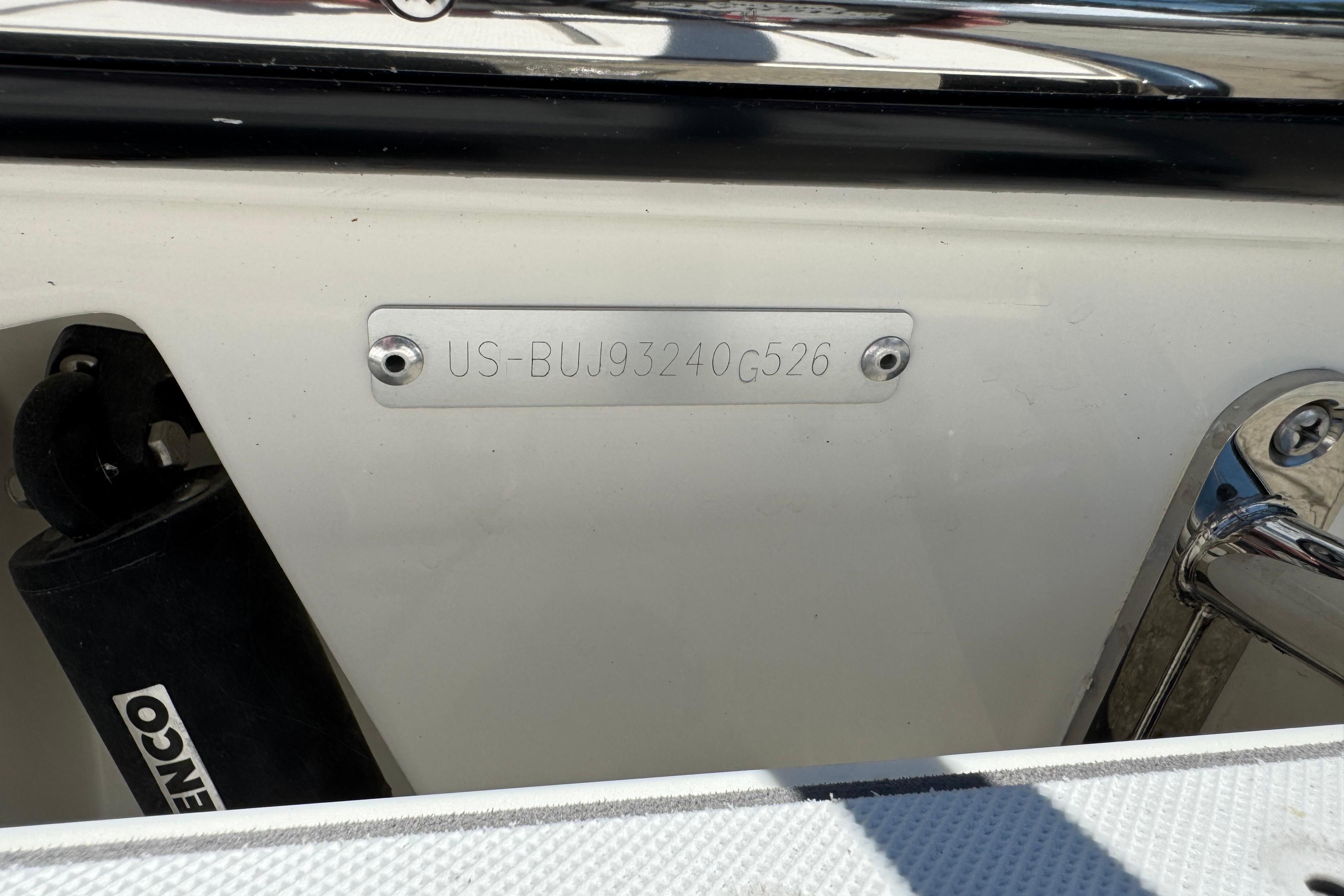 2026 Mako 214 Center Console boat with visible hull identification number.