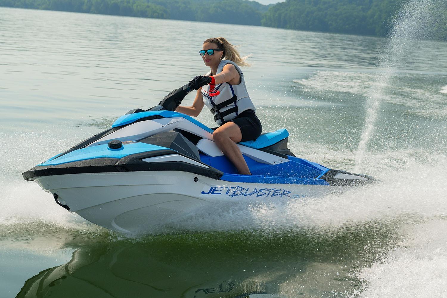 Manufacturer Provided Image: Person riding 2026 Yamaha WaveRunner JetBlaster DLX 2-Up on a lake, creating a splash.