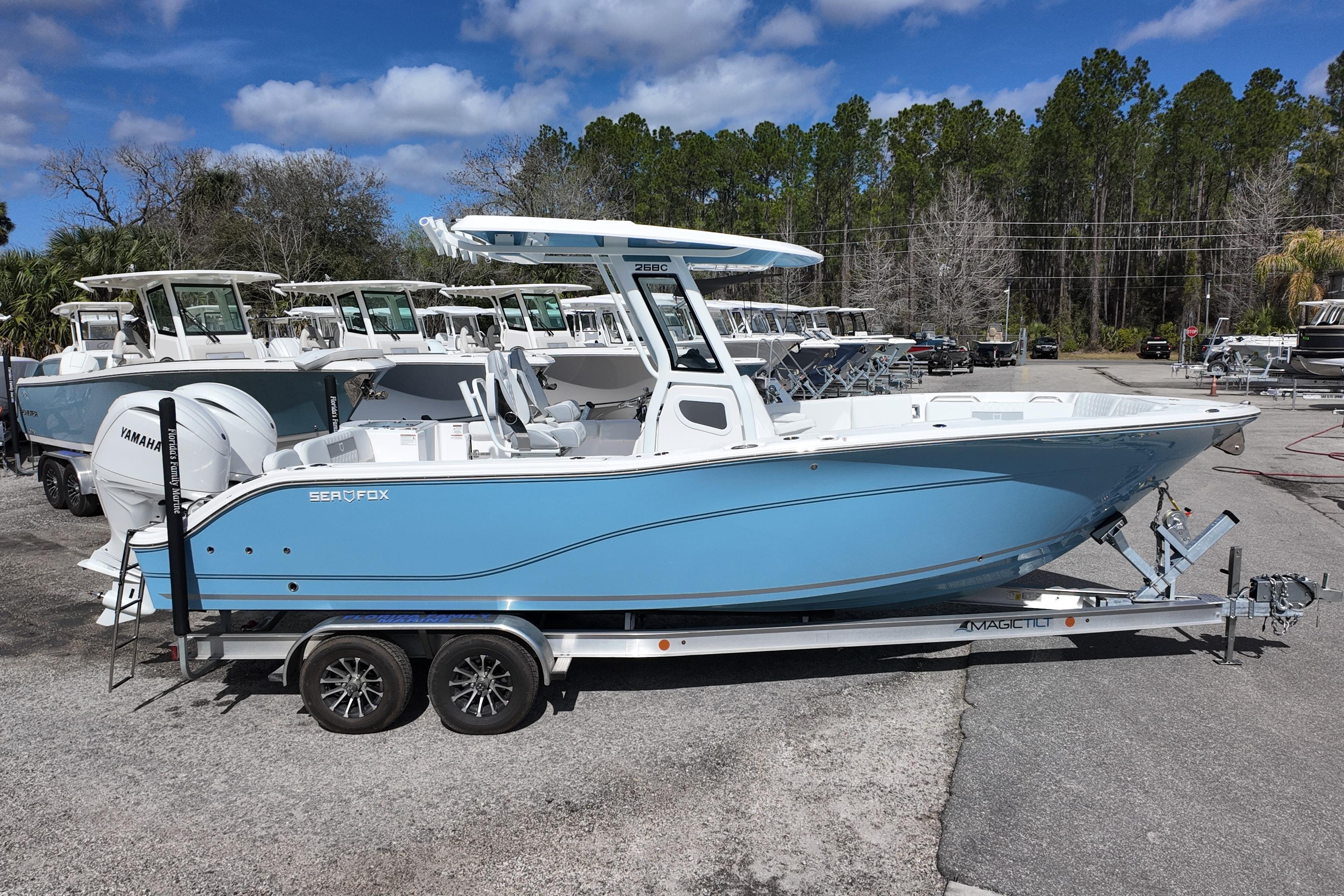 2026 Sea Fox 268 Commander boat on trailer, displayed outdoors under blue sky.