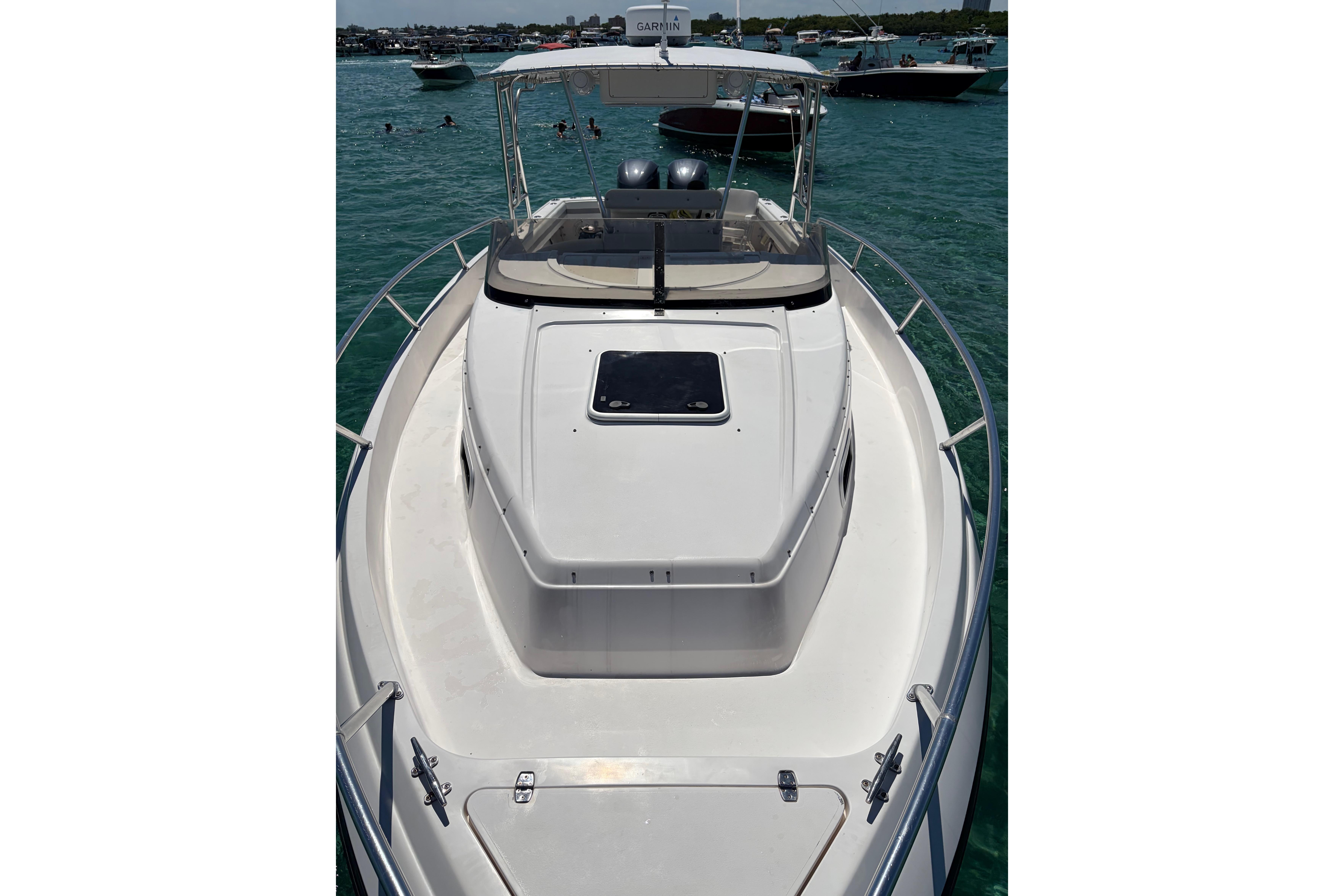 1998 Intrepid 339 Walkaround boat on clear water, featuring spacious deck and sleek design.