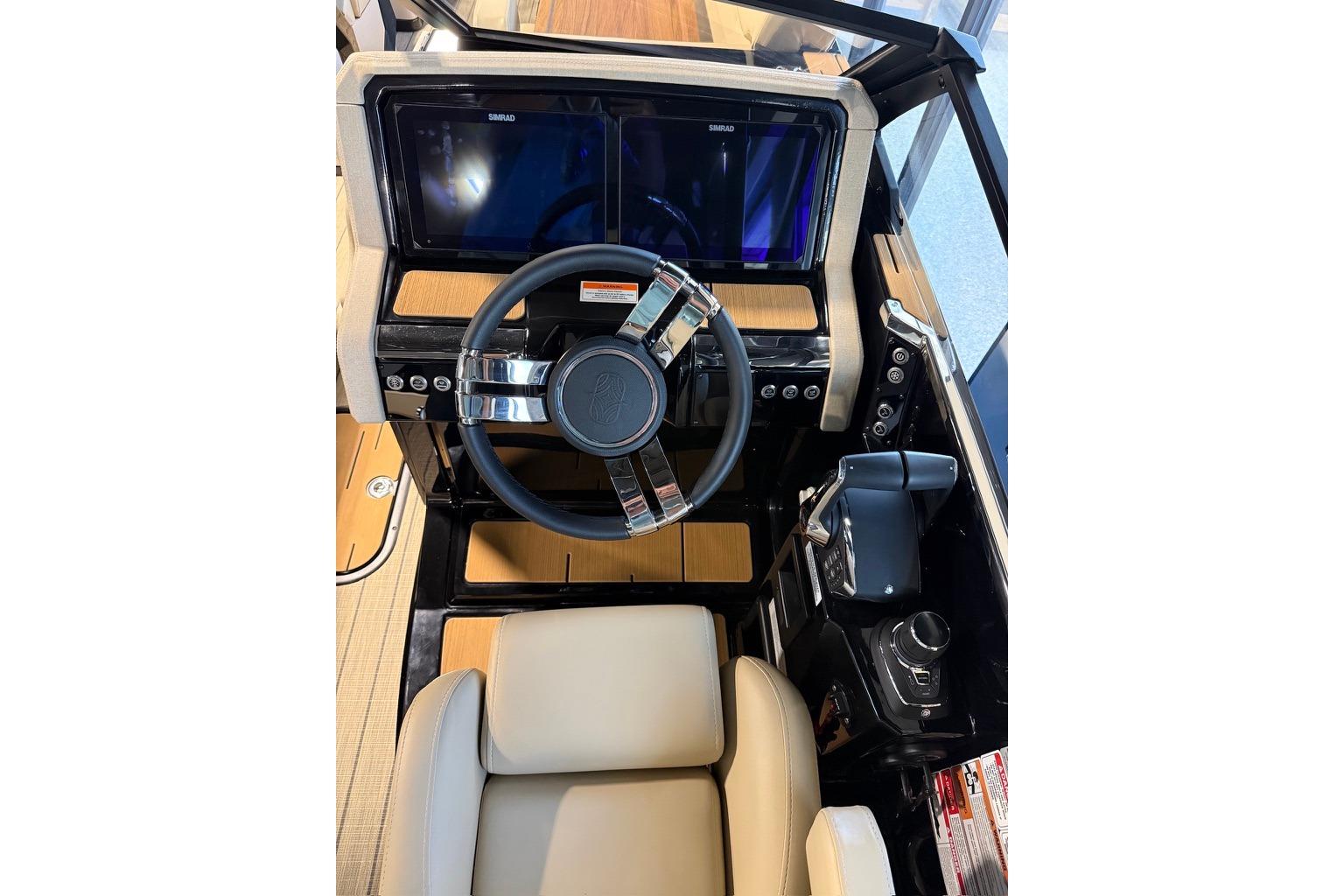 Interior cockpit of 2026 Balise Halo 26C Twin boat with modern steering and controls.