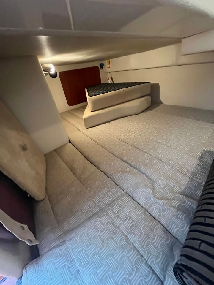 Interior of a 2011 Monterey 280SCR yacht with cozy sleeping area.