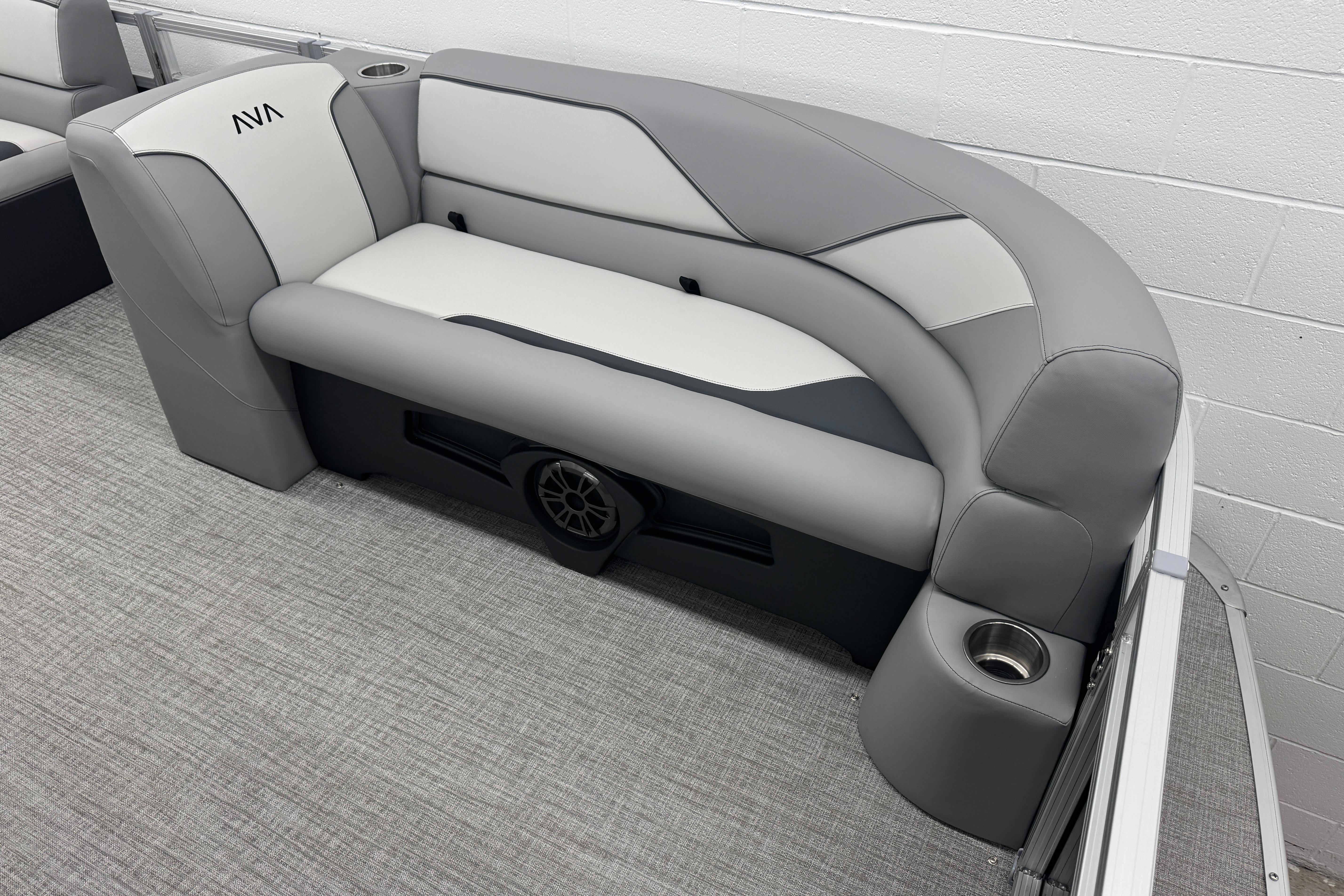 Luxurious seating in the 2026 Avalon Ventue 85 RF boat, featuring sleek gray upholstery.