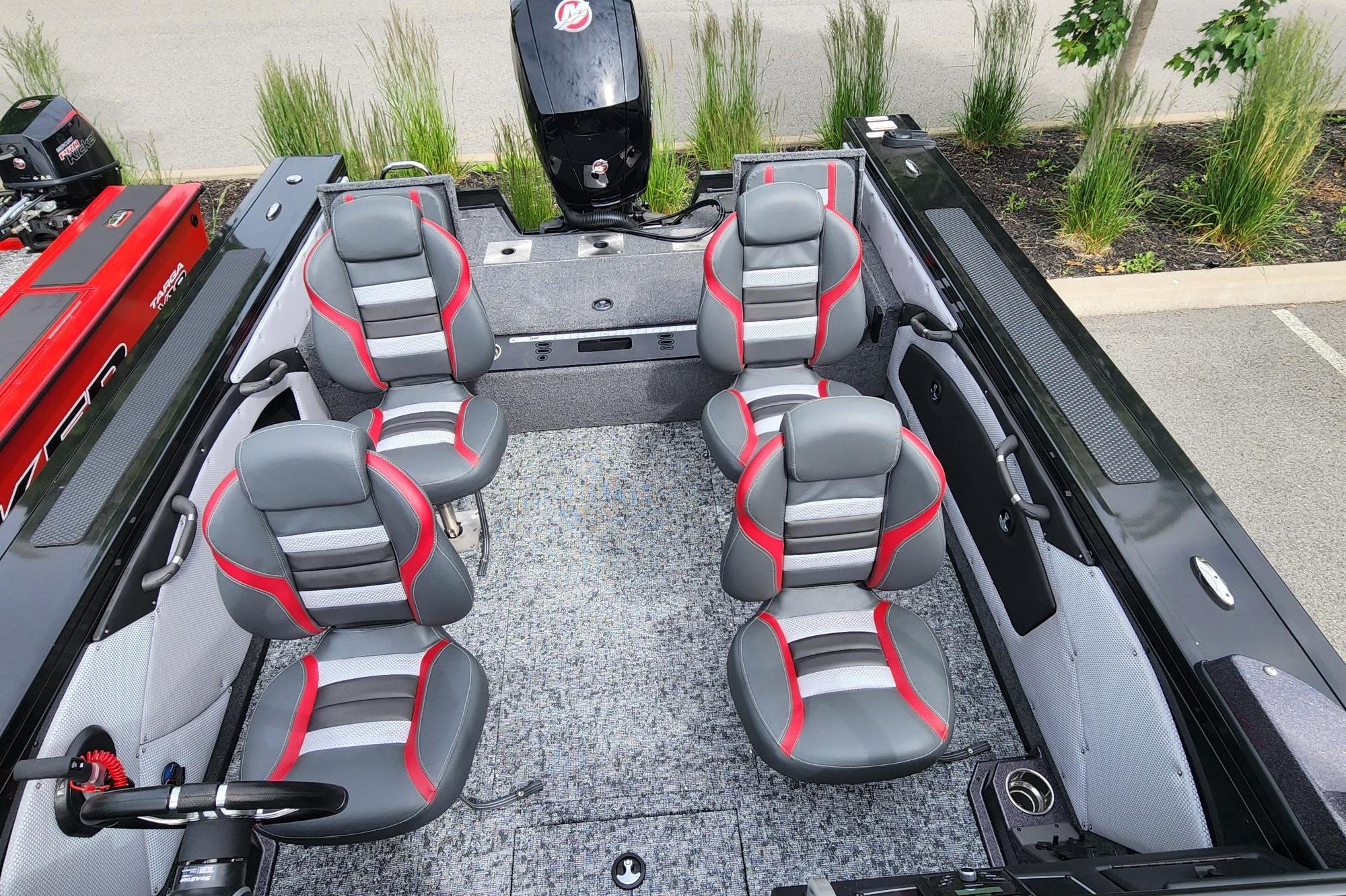 2026 Ranger VX1788 WT boat interior with four gray and red seats, parked outdoors.