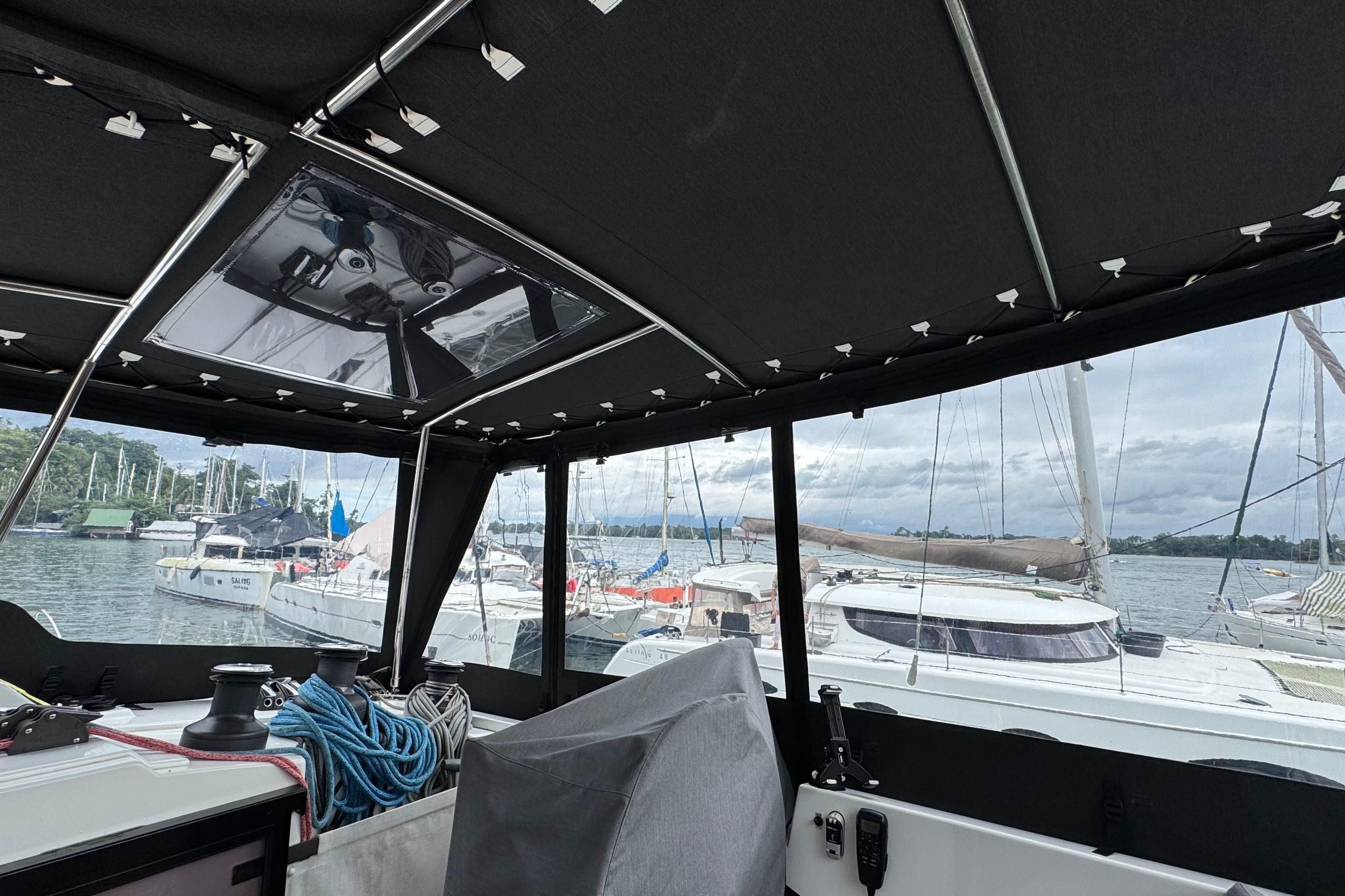 Interior view of a 2020 Fountaine Pajot Saona 47 catamaran docked at a marina.