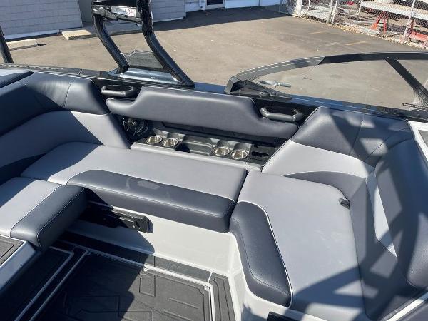 2025 Moomba Mondo boat interior with gray seating and cup holders.