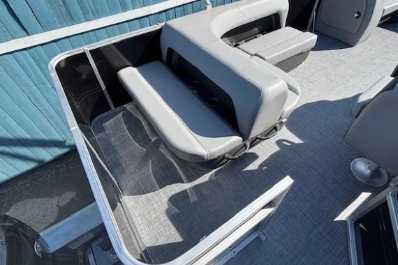 2026 Sun Tracker Party Barge 18 DLX interior with gray seating and flooring.