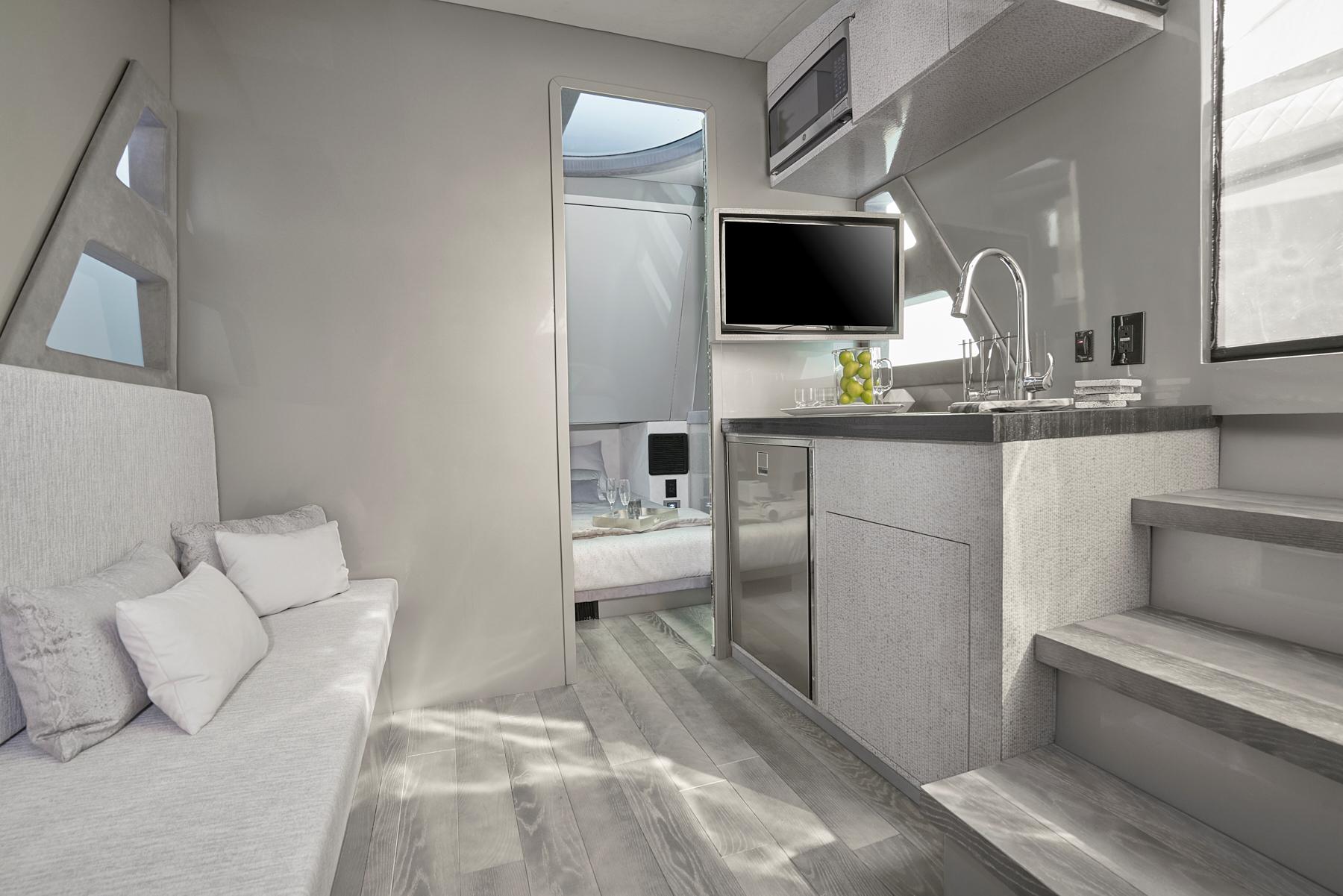 Modern interior of 2019 Midnight Express 60' Pied-A-Mer yacht with kitchenette and seating area.
