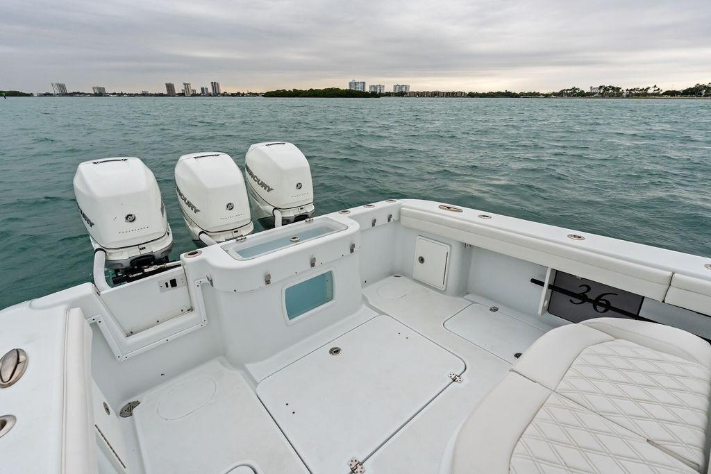 2021 Yellowfin 36 Offshore boat with triple Mercury engines on open water.