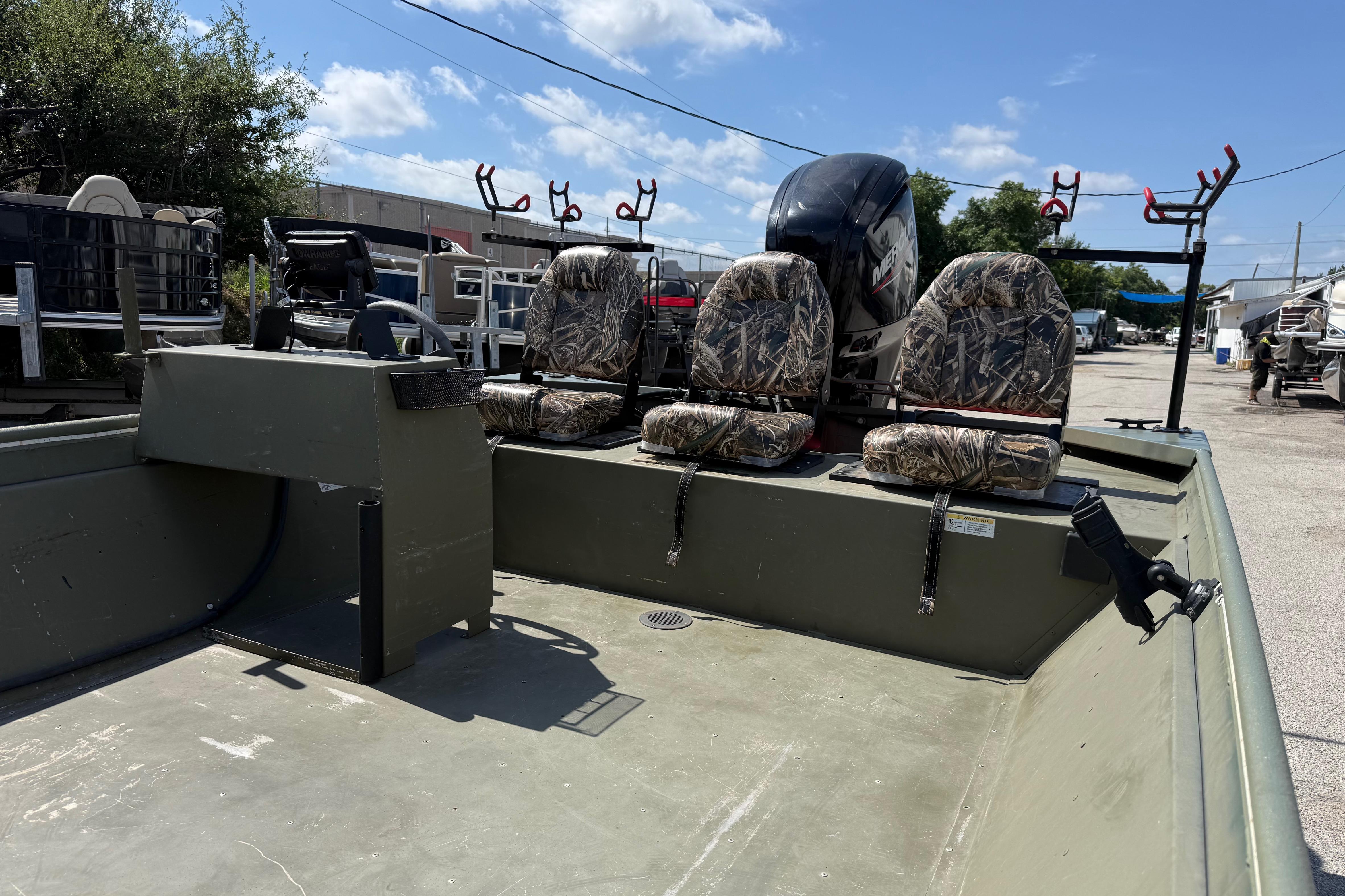 The image shows a 2020 Lowe Roughneck 2070 Big River boat with three seats and fishing rod holders.