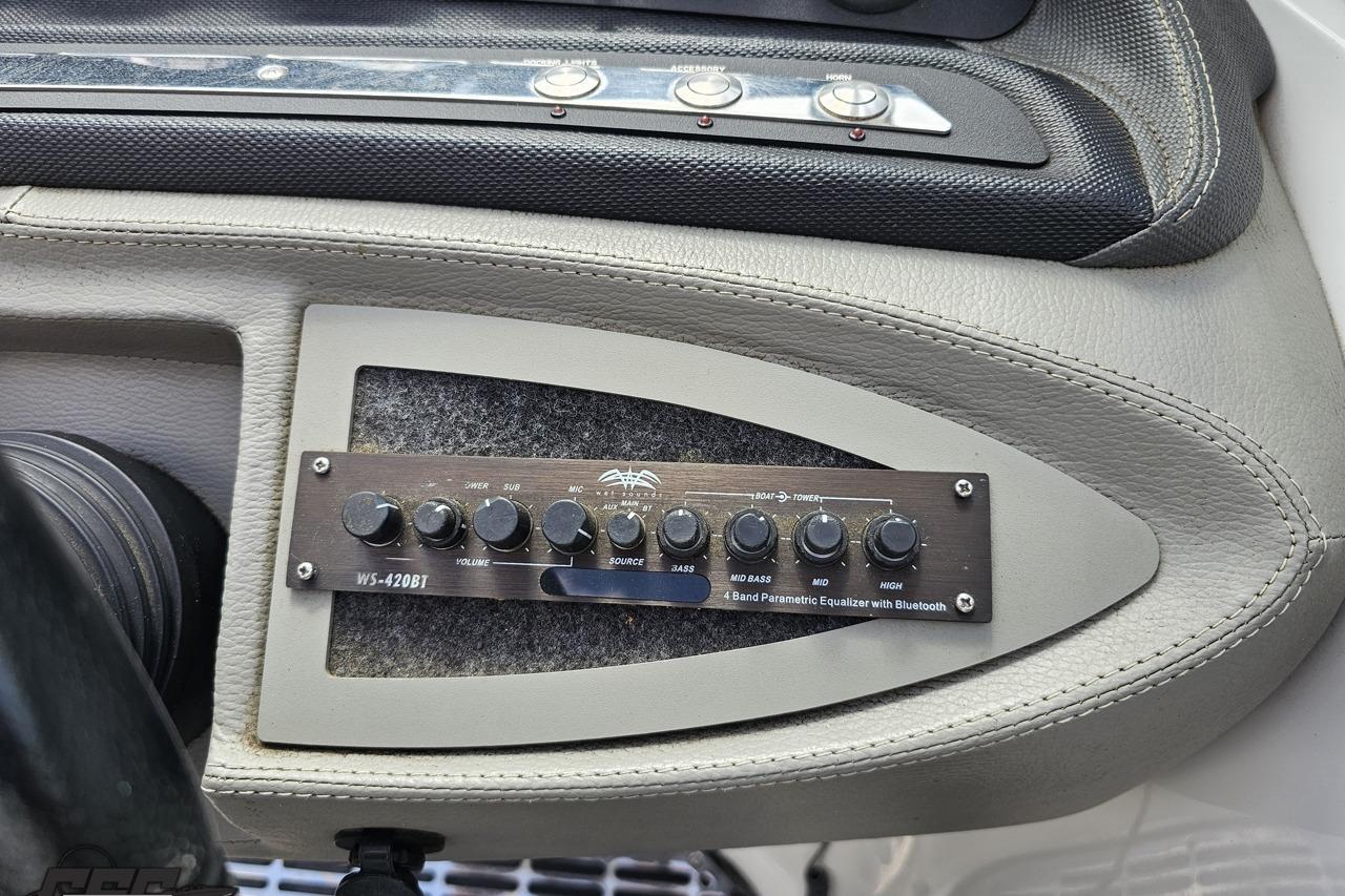 2010 Cobalt 232 WSS boat dashboard with WS-420BT equalizer and control buttons.