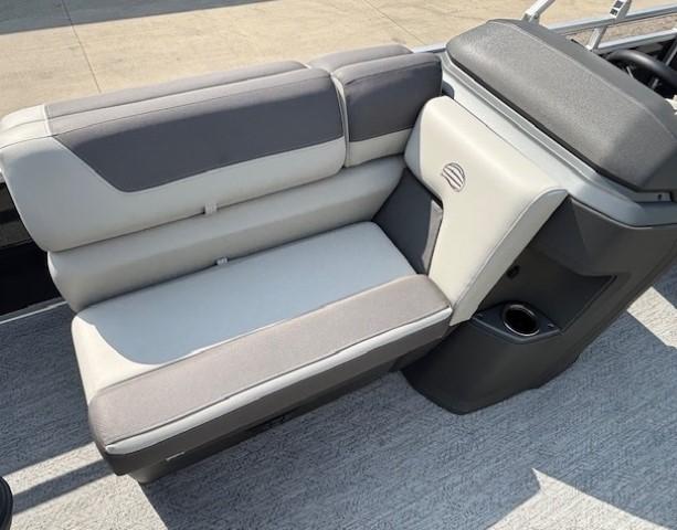 2026 Sun Tracker Fishin' Barge 20 DLX boat seat with gray and beige upholstery.