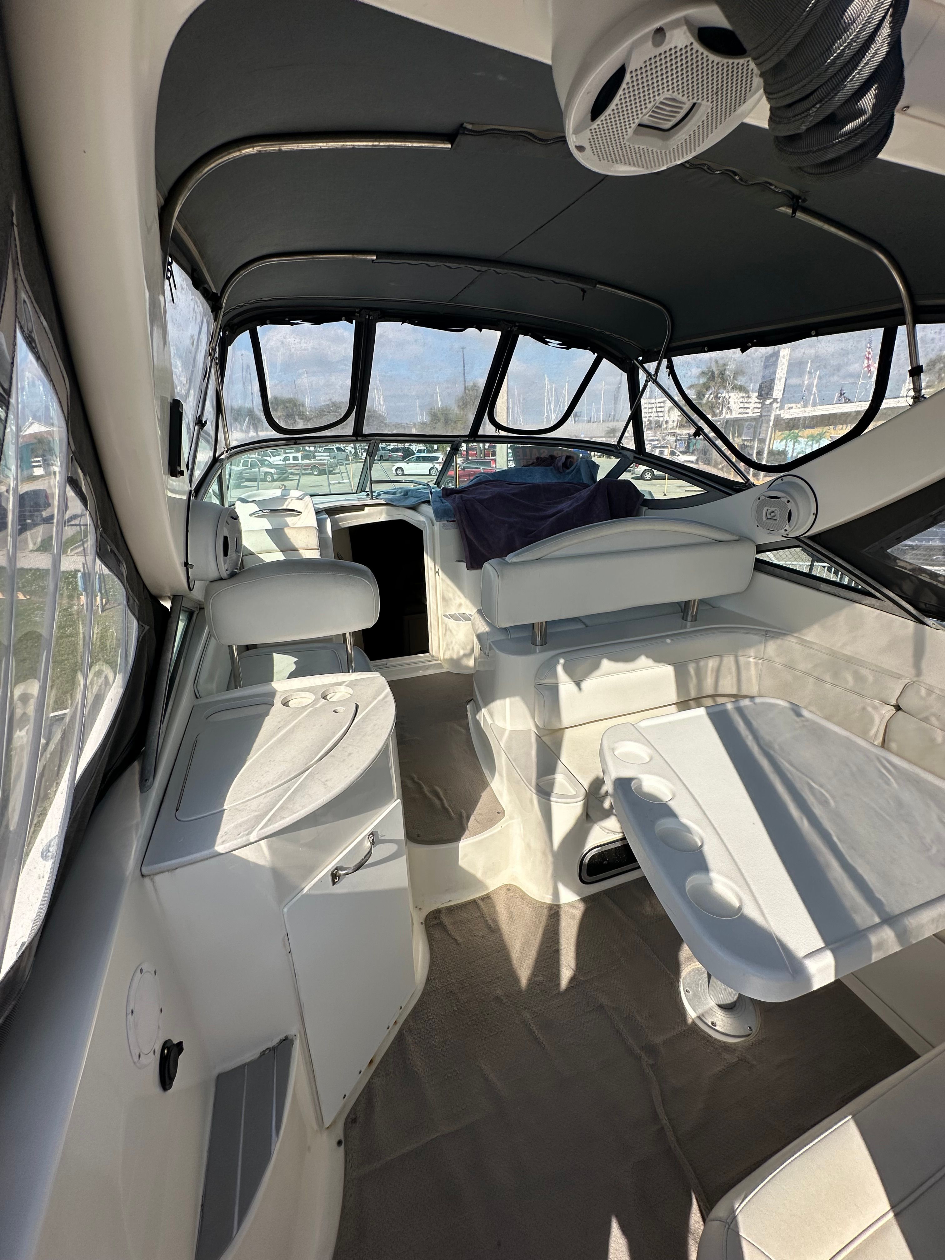 Interior of a 1999 Wellcraft 3000 Matrinique boat with seating area.