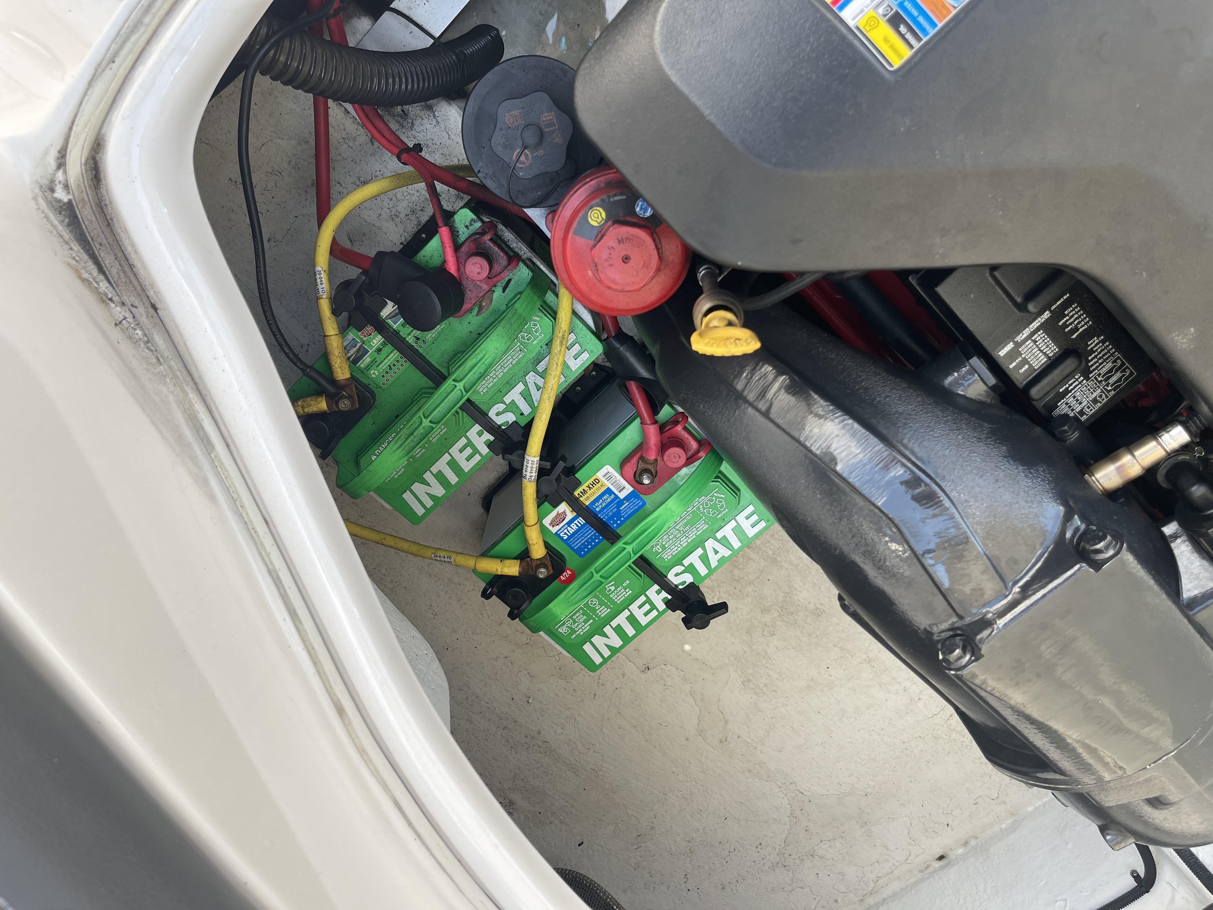 2014 Chaparral Sunesta 224 engine compartment with Interstate batteries and wiring.