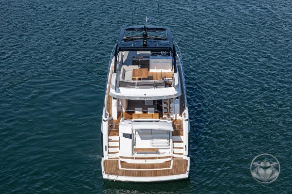 2025 Sunseeker Manhattan 68 yacht on open water, aerial view.