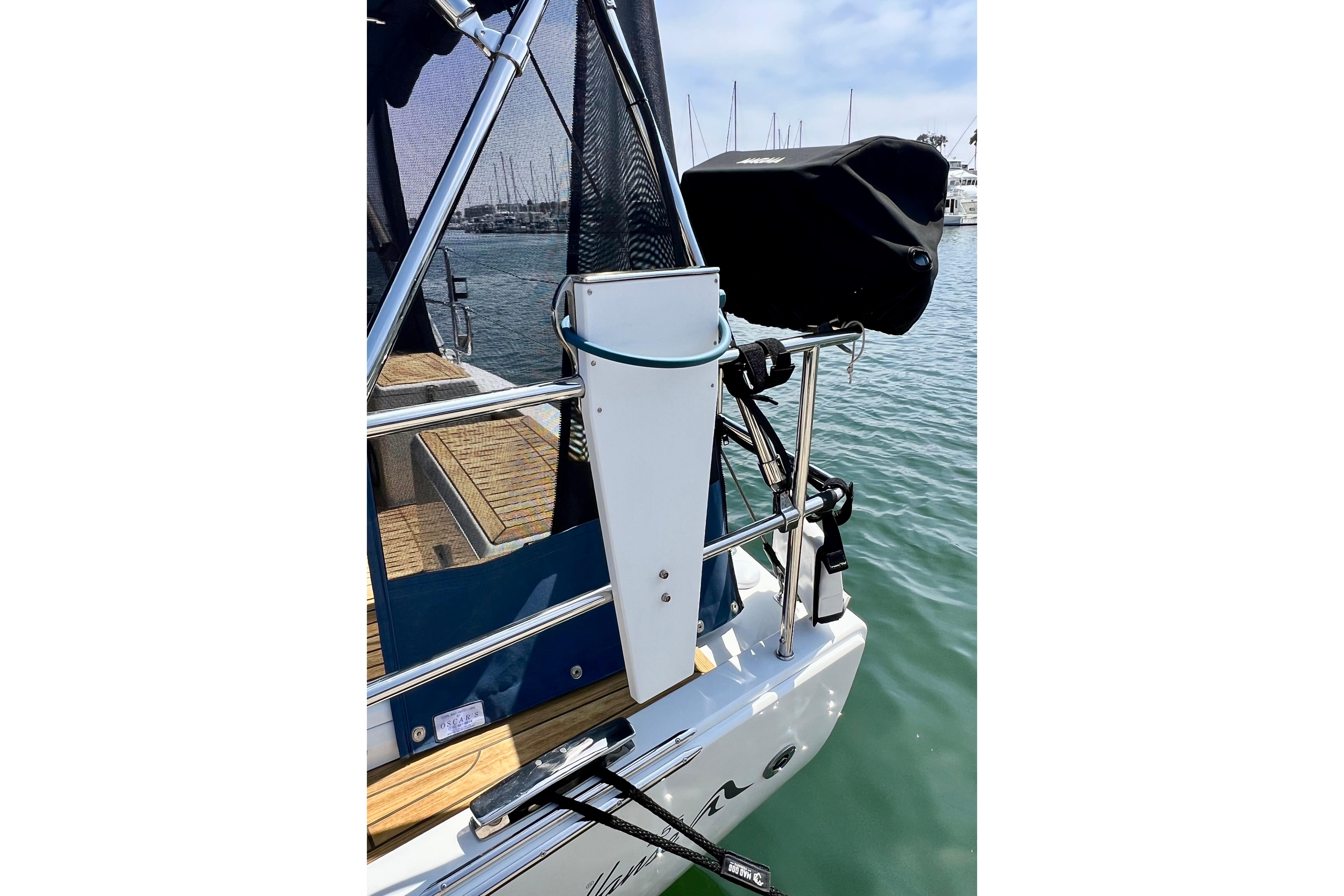 Sailboat Hanse 455 (2016) stern view with equipment and marina background.