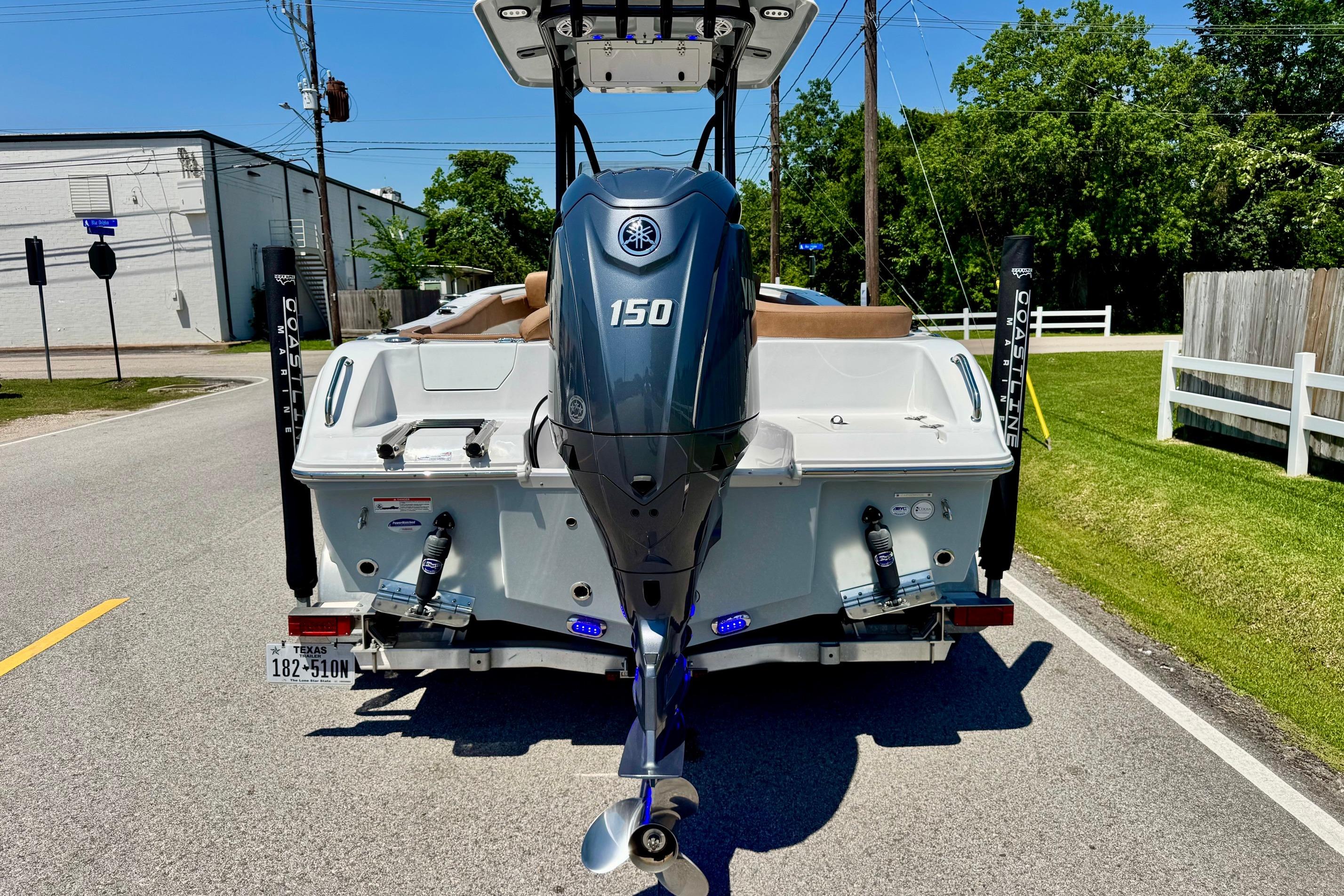 2025 Sea Hunt Ultra 219 boat with Yamaha 150 engine on a trailer.