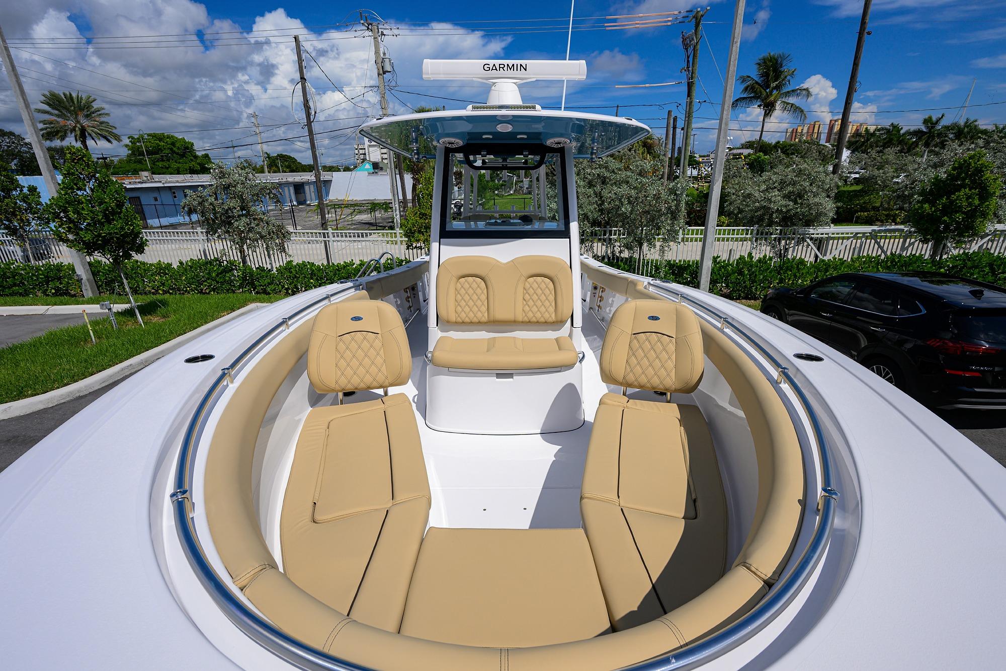 2026 Sportsman Open 302 Center Console boat with tan seating and Garmin equipment.