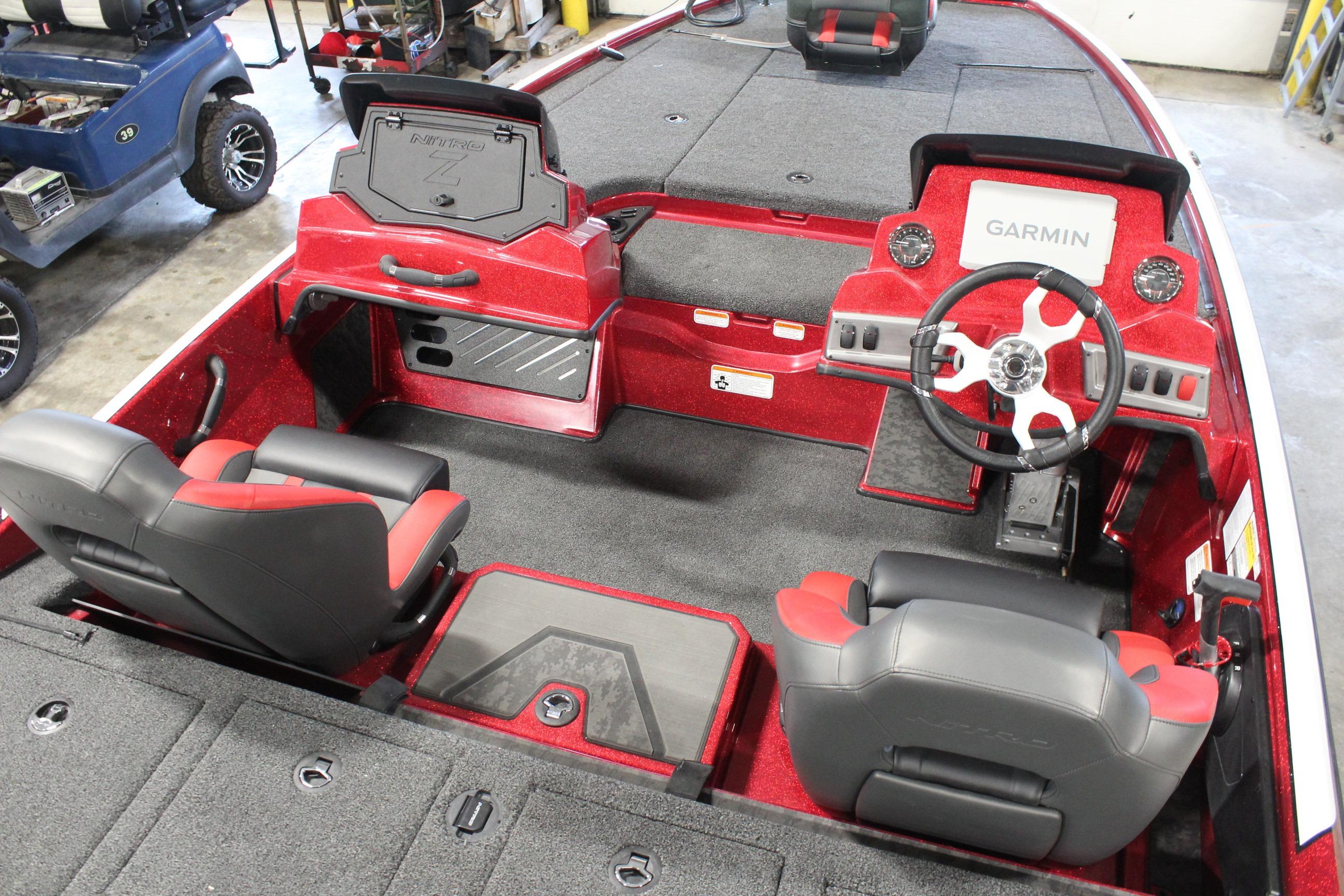 2026 Nitro Z19 XL Pro boat interior with Garmin dashboard and red-black seating.