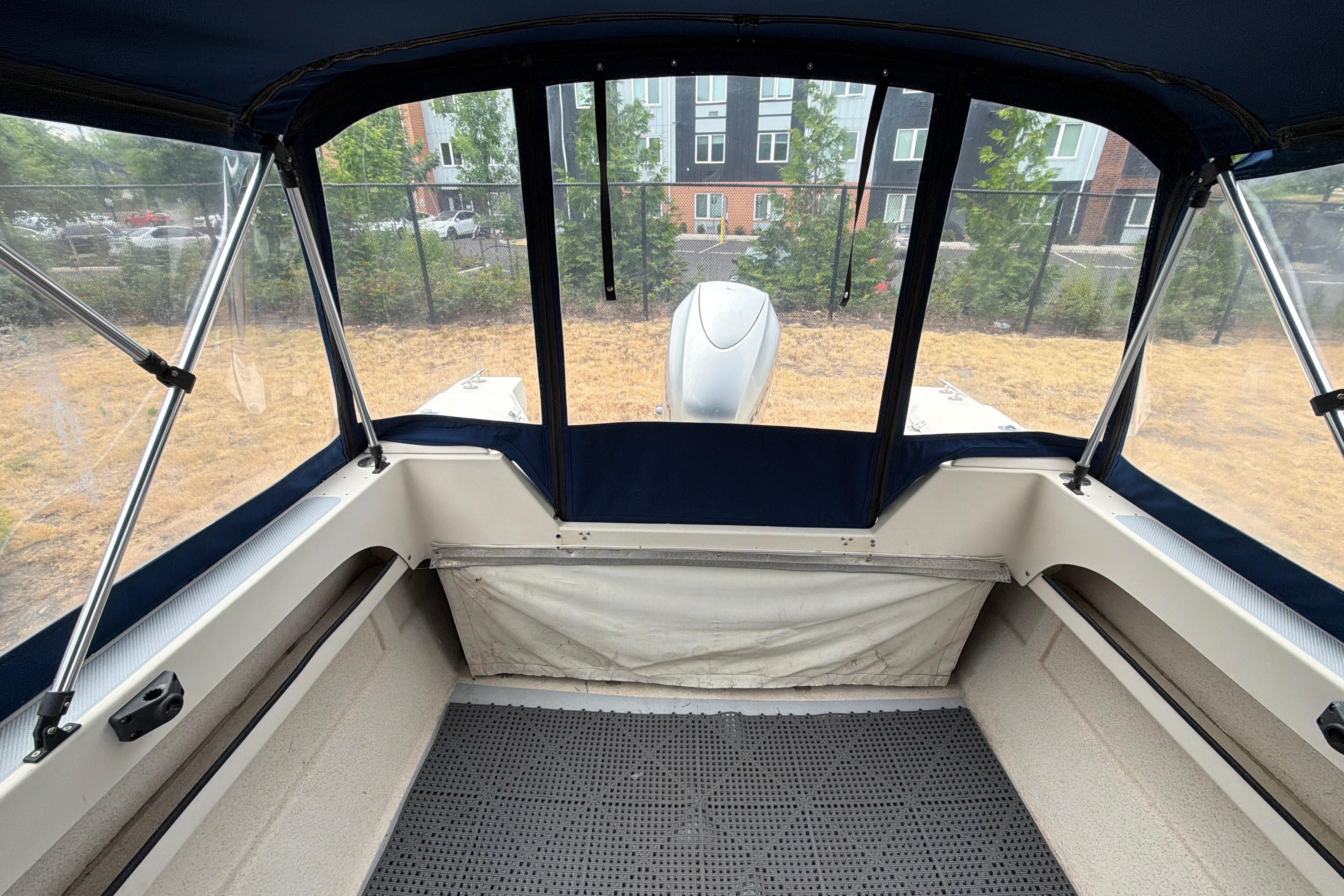 Interior view of a 1989 C-Dory 22' Angler boat with canopy and seating.