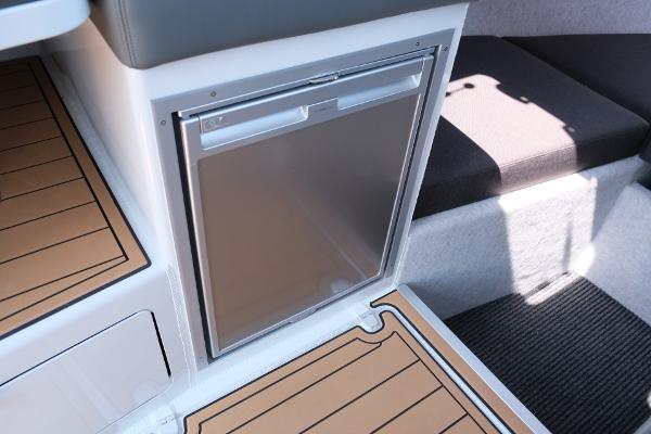Makaira Gen3 800 boat interior with compact fridge, 2023 model.