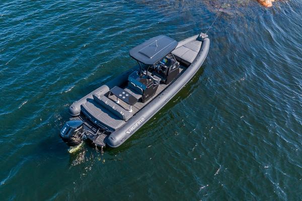 Manufacturer Provided Image: 2025 Highfield Sport 900 boat on water, aerial view.