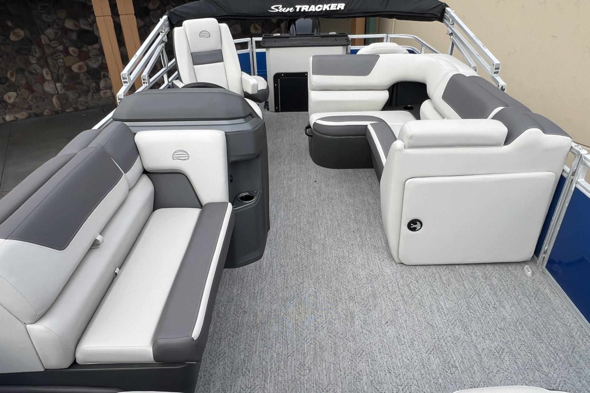 2026 Sun Tracker Fishin' Barge 20 DLX interior with spacious seating and modern design.
