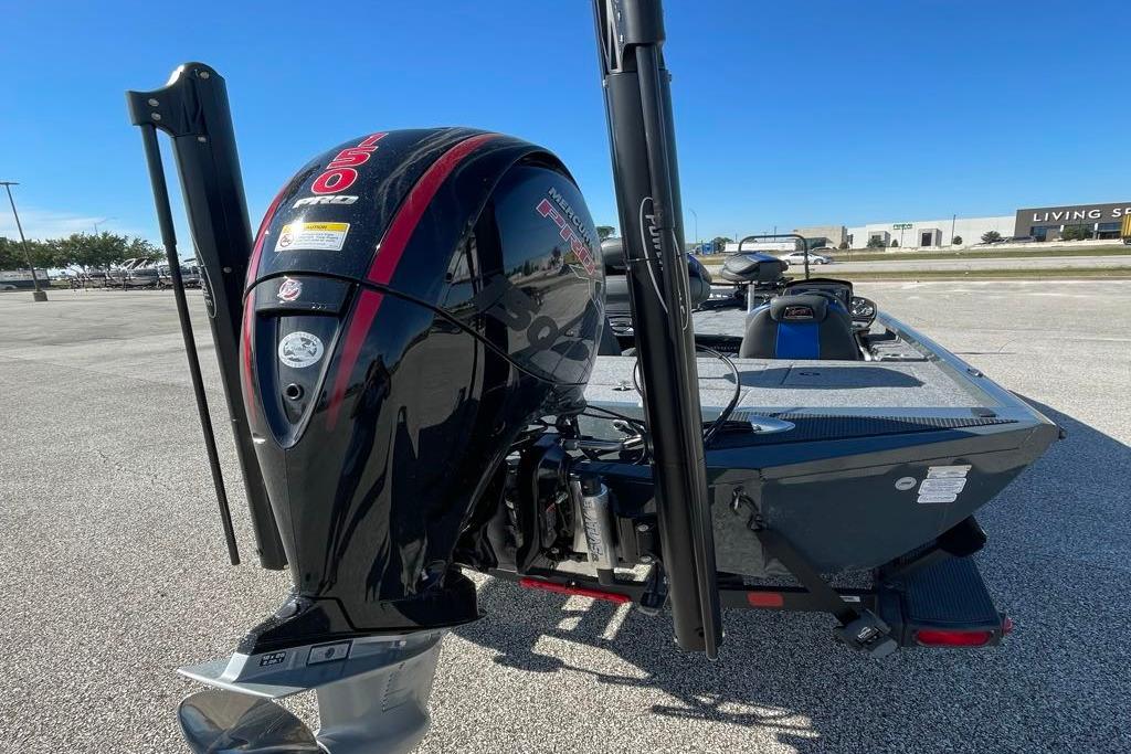 2026 Ranger RT198P boat with powerful outboard motor in a parking lot.