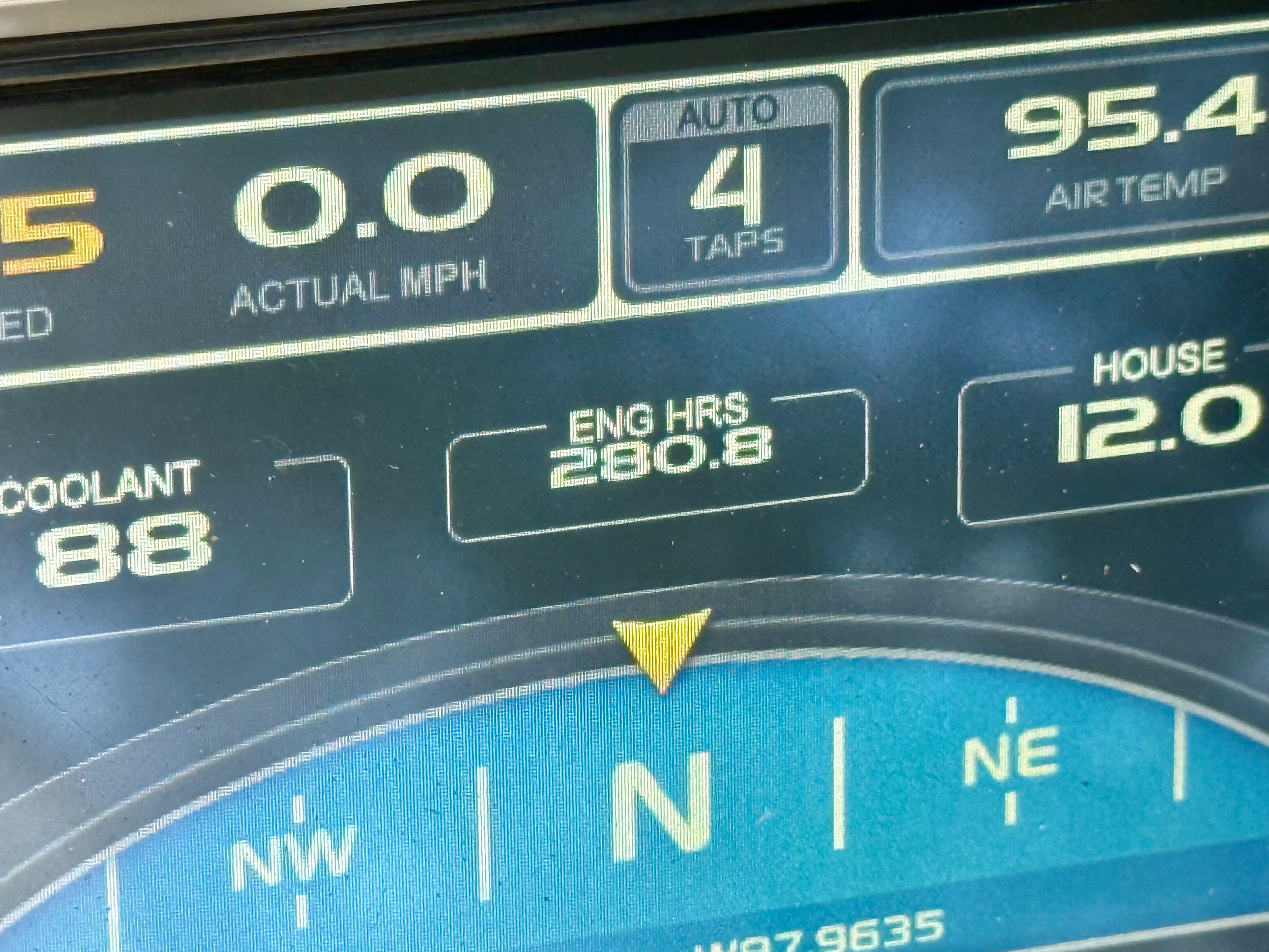 Close-up of a boat display showing navigation and engine information.