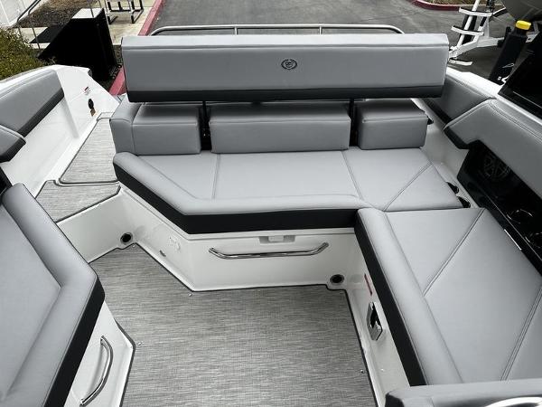 Luxurious seating area on 2025 Cobalt R4 boat with sleek gray upholstery.
