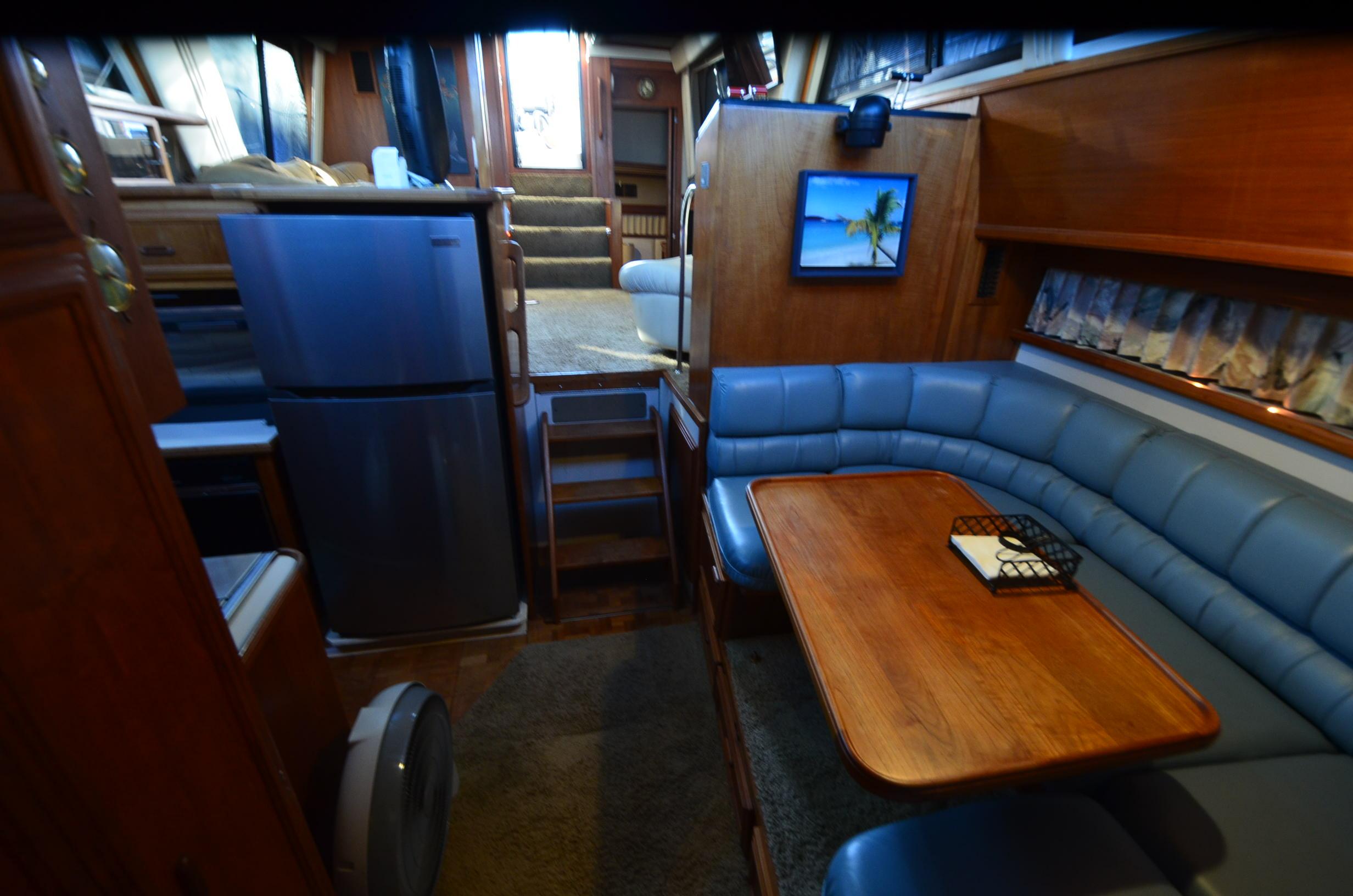 Interior of 1988 Carver 4207 Aft Cabin MY with dining area and kitchen.