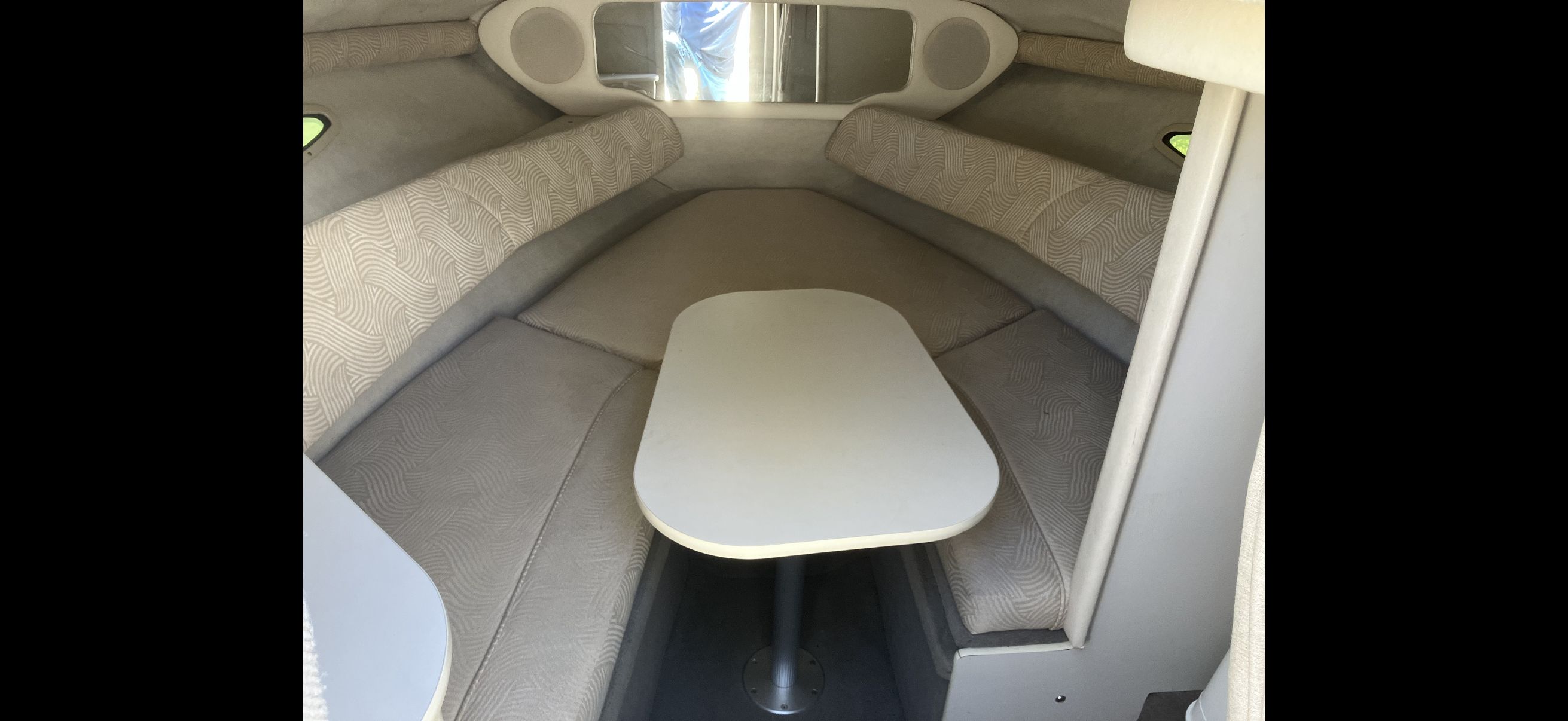 Interior of 2007 Sea Ray 215 Weekender with seating area.