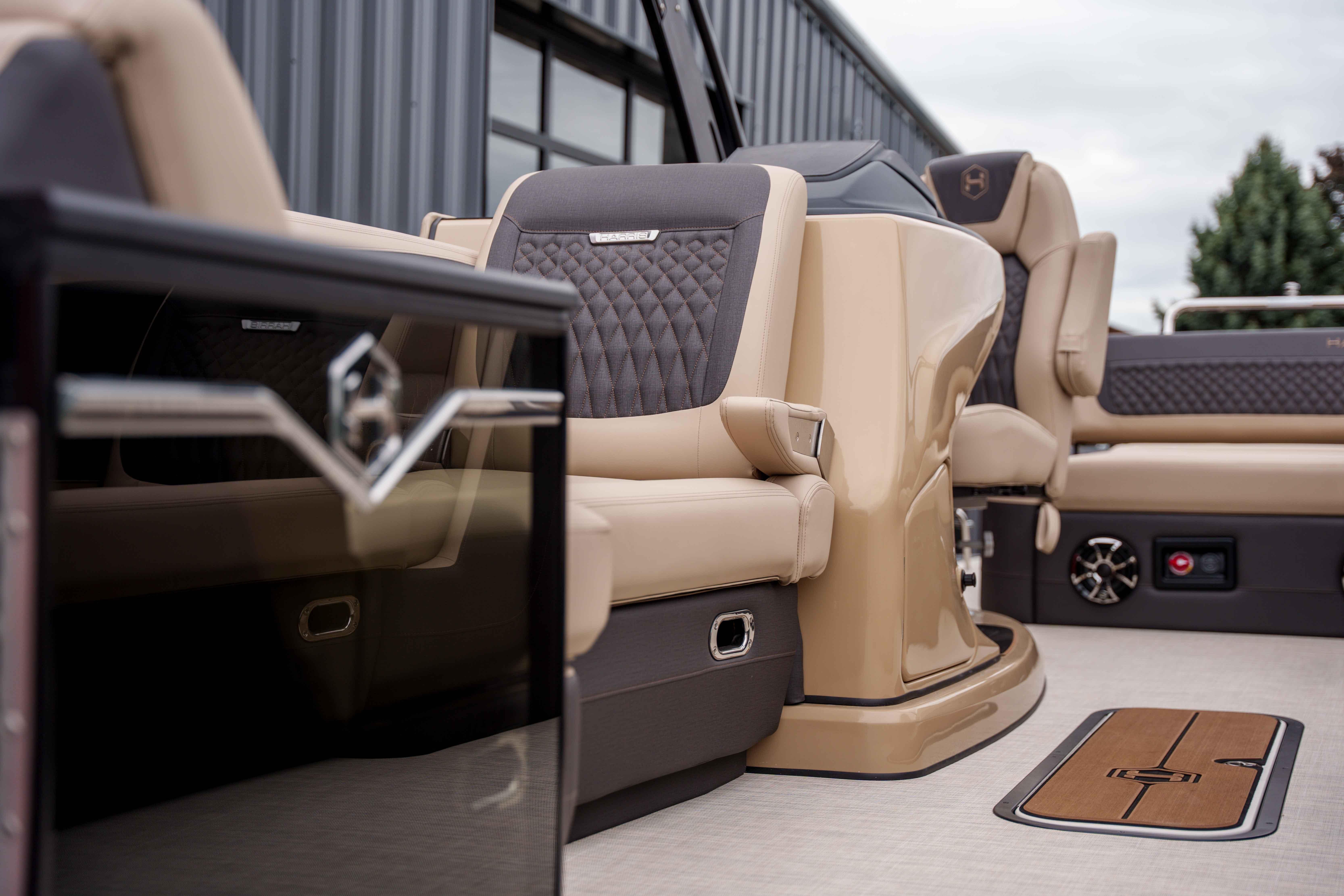 Luxurious interior of 2026 Harris Sunliner 230 pontoon boat with plush seating and modern design.