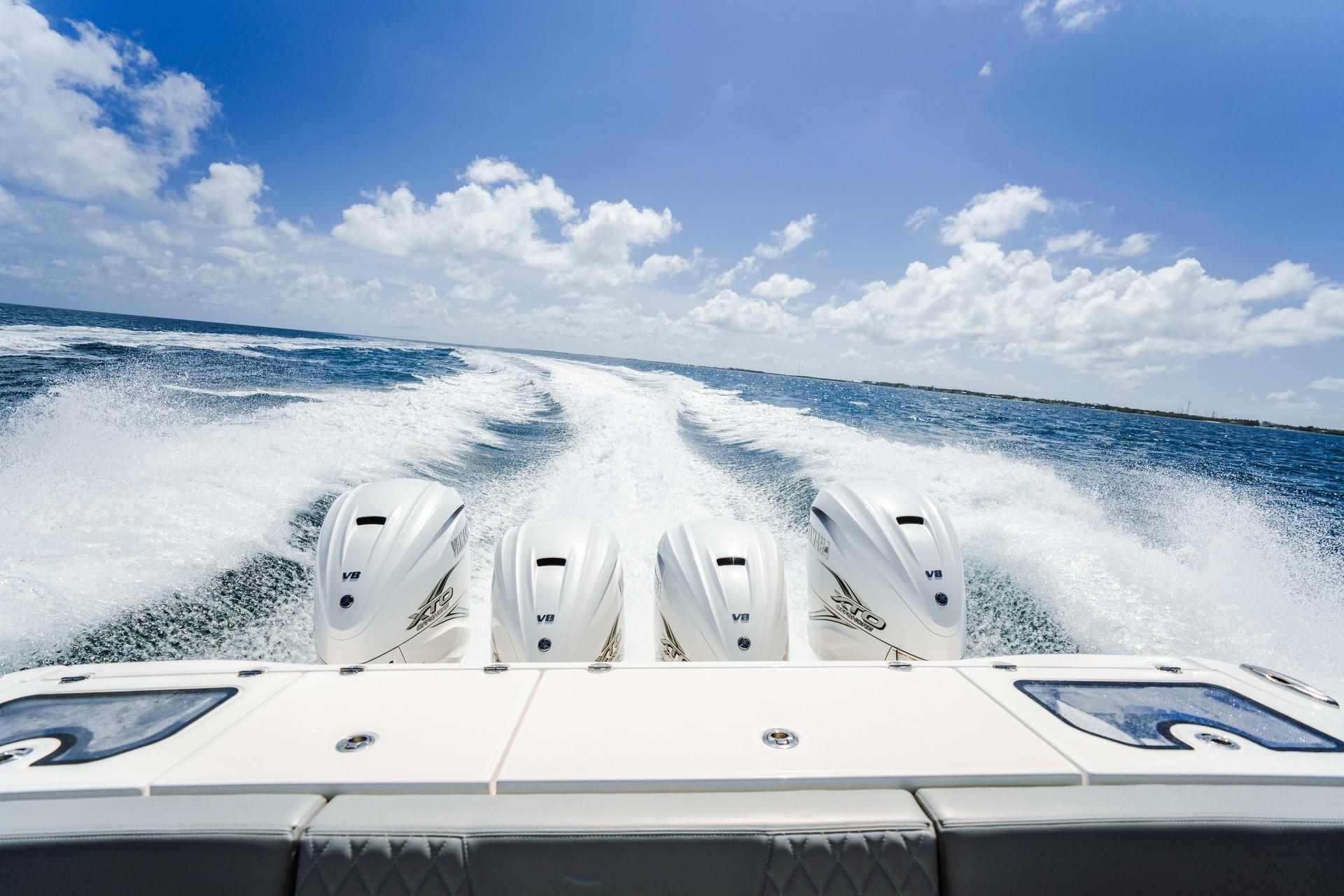 2026 Everglades 455 Center Console boat with four powerful V8 engines on open water.