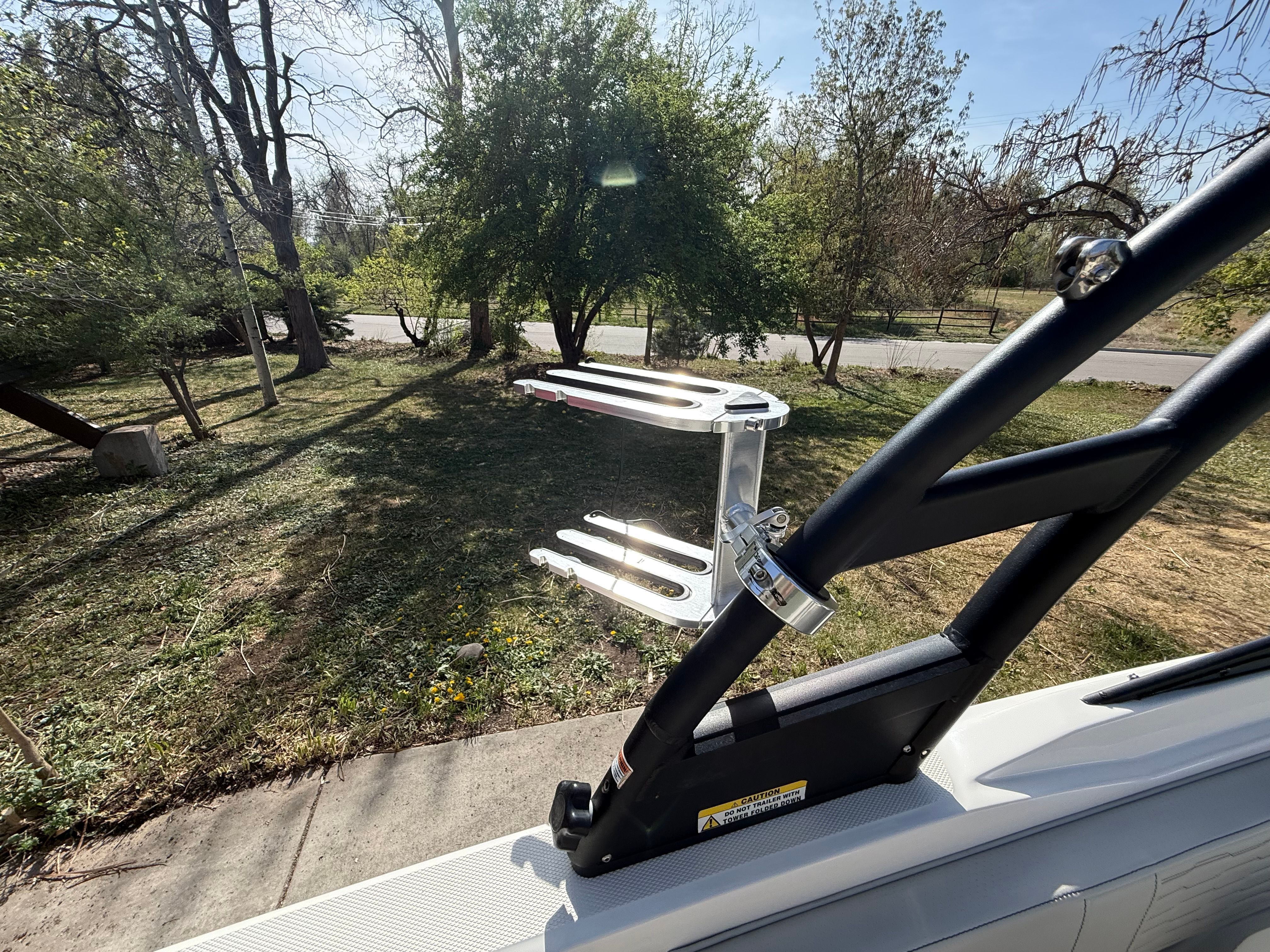 Sea Ray SPX 210 boat with wakeboard rack, 2022 model.
