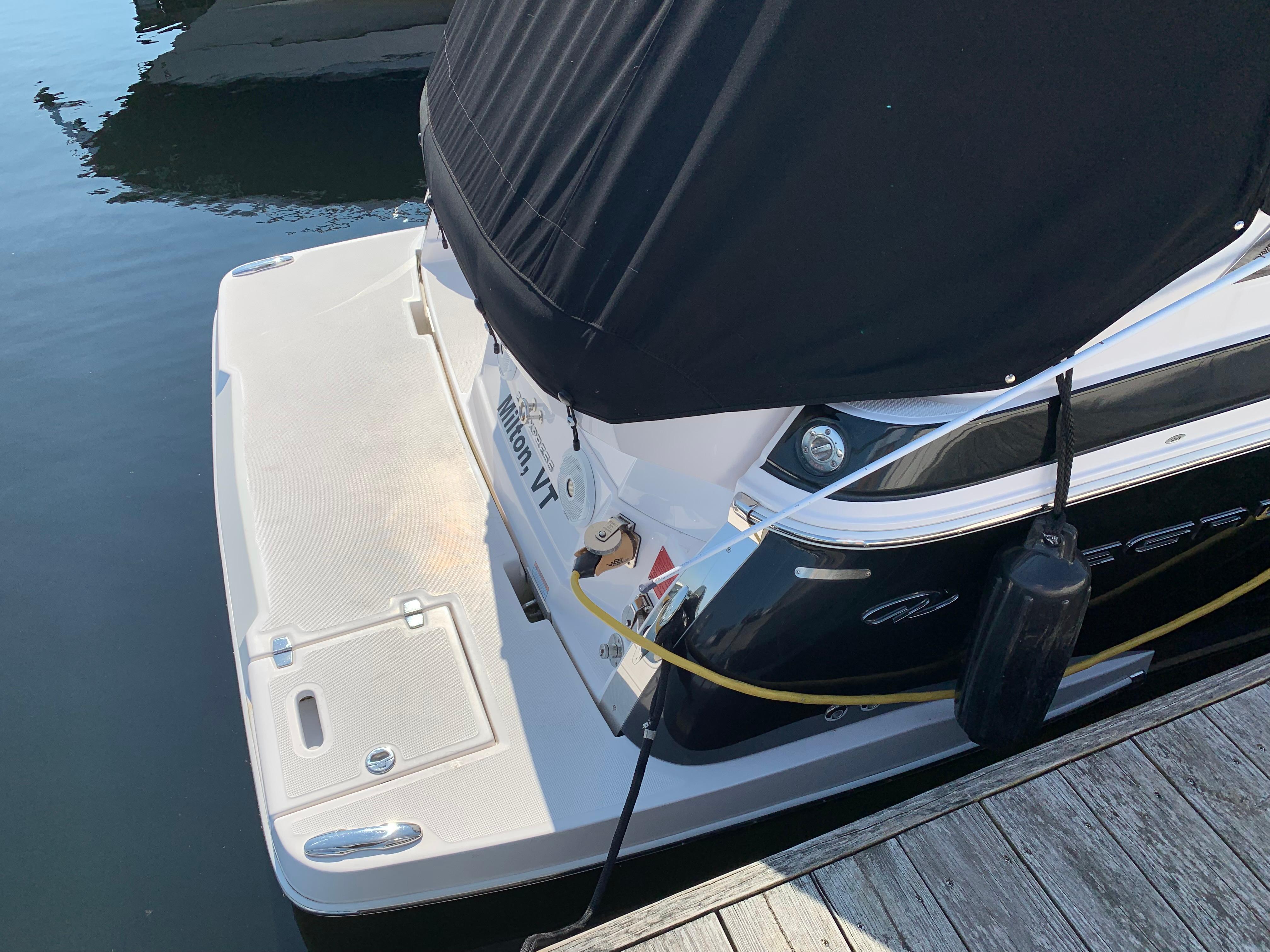 Rear view of a 2018 Regal 28 Express boat at the dock.