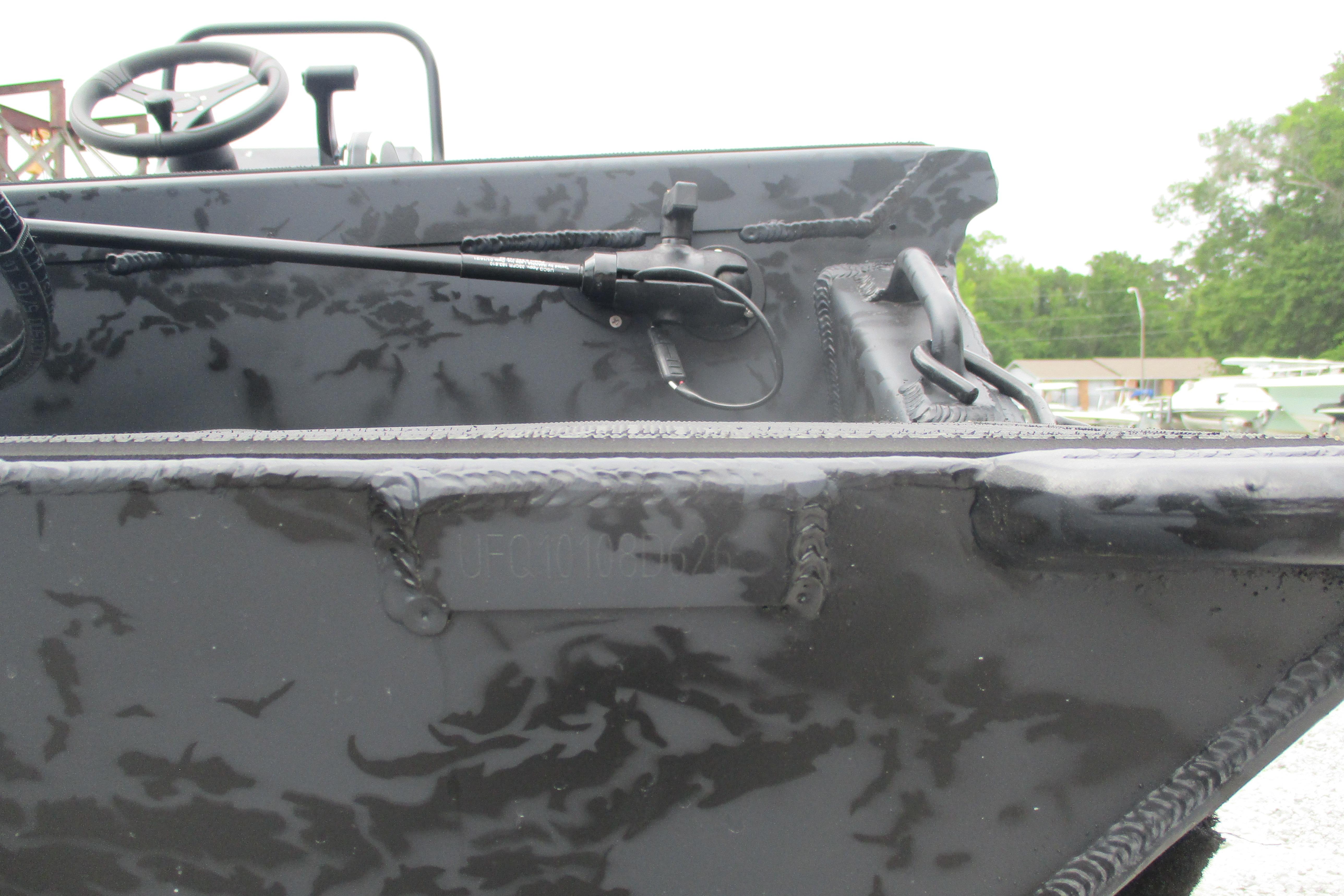 2026 Gator Tail 1860 Extreme CC boat with steering wheel and control lever.