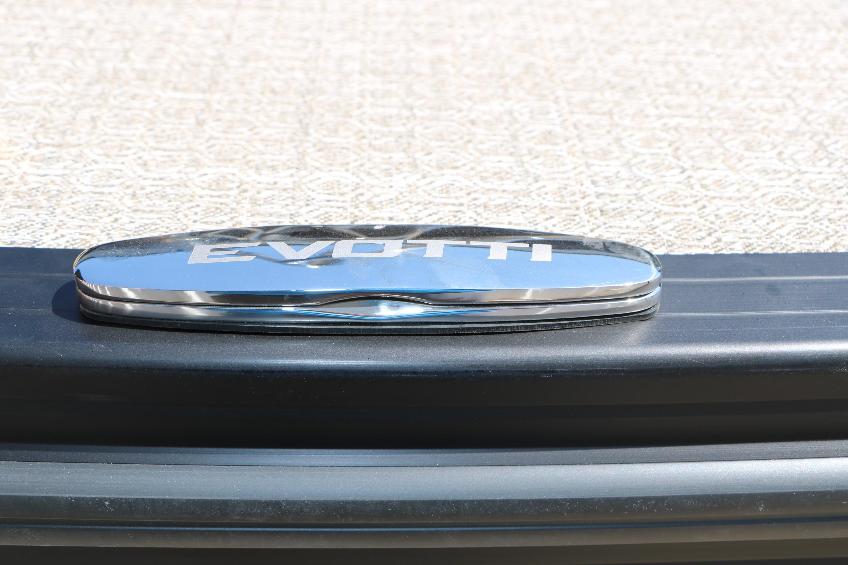 Chrome Evotti logo on 2026 Evotti 725 CS Tri-Toon boat, close-up view.