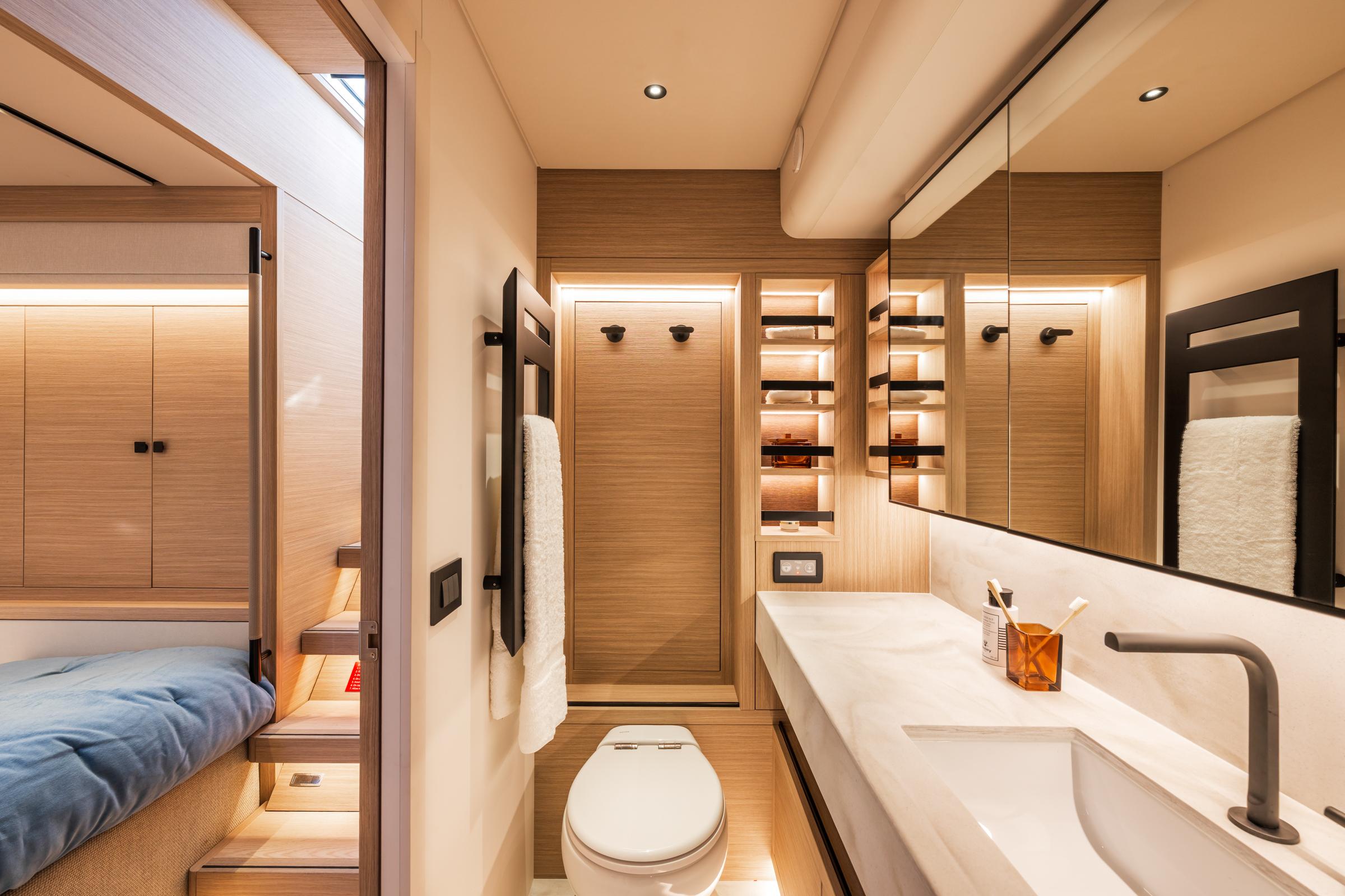 Luxurious bathroom interior of 2025 Lagoon Eighty 2 yacht, featuring modern design and elegant fixtures.