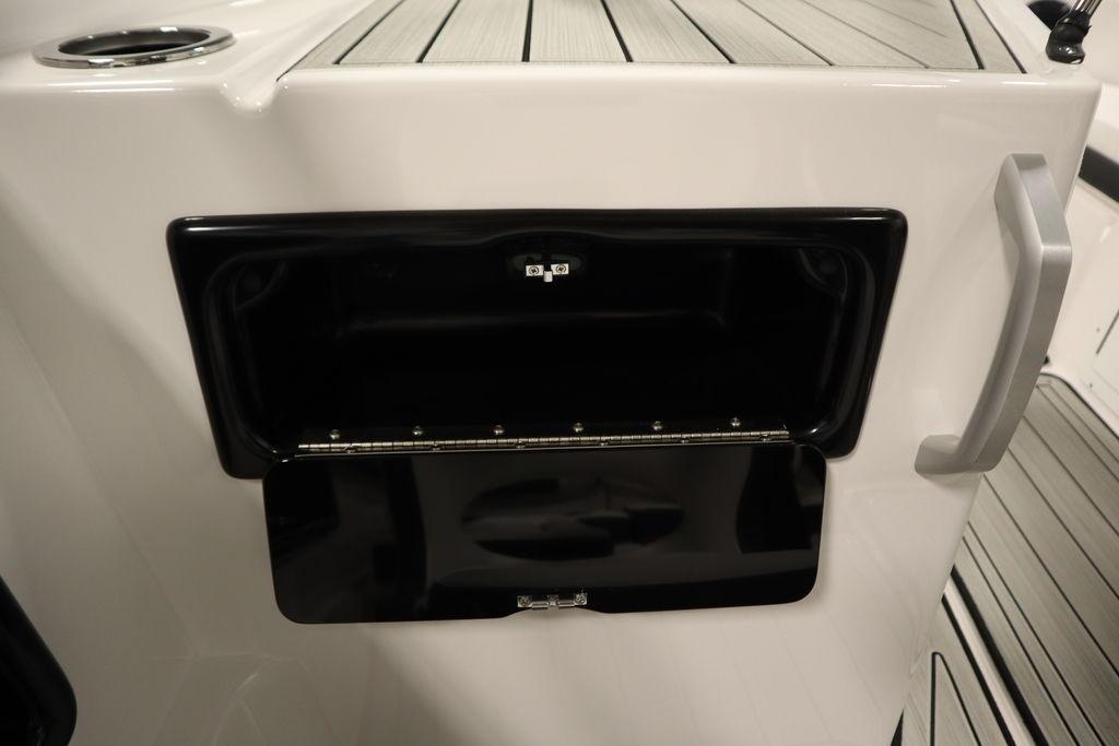 2026 Yamaha Boats 195S storage compartment with open hatch and sleek design.