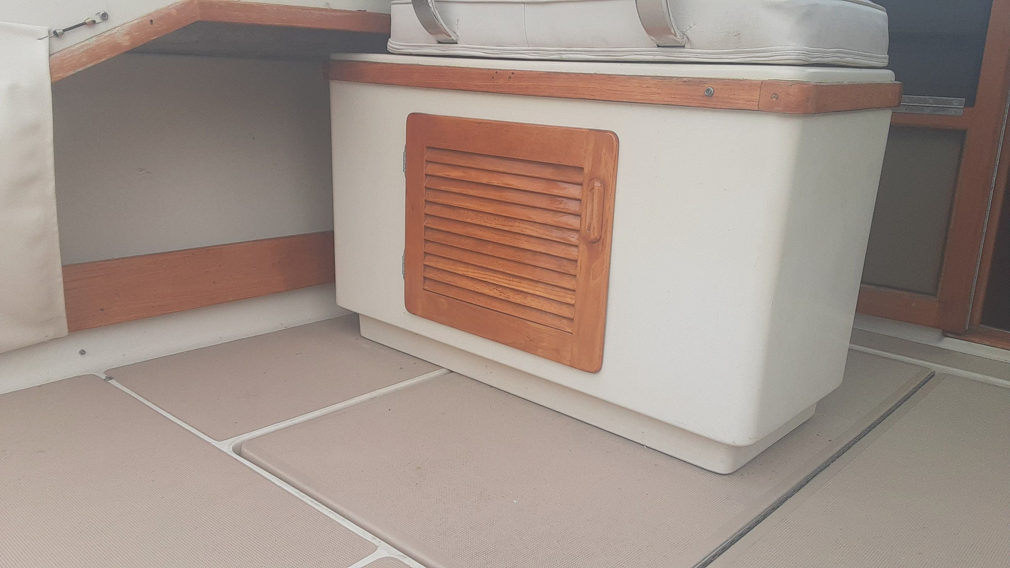 Interior of a 1985 Tiara Yachts 3100 Open with wooden accents.