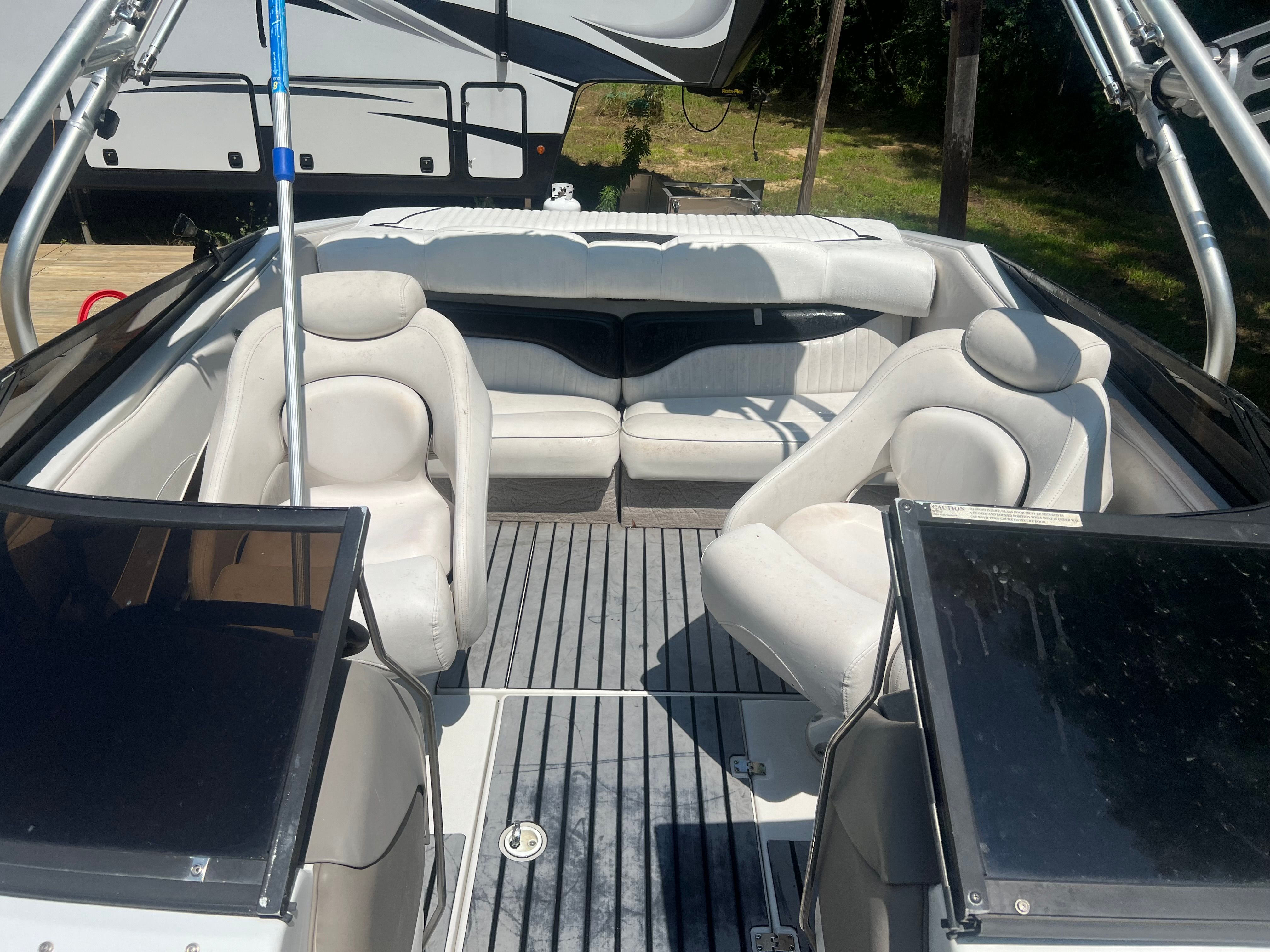 Interior of a 2001 Crownline 202 BR boat with white seating.