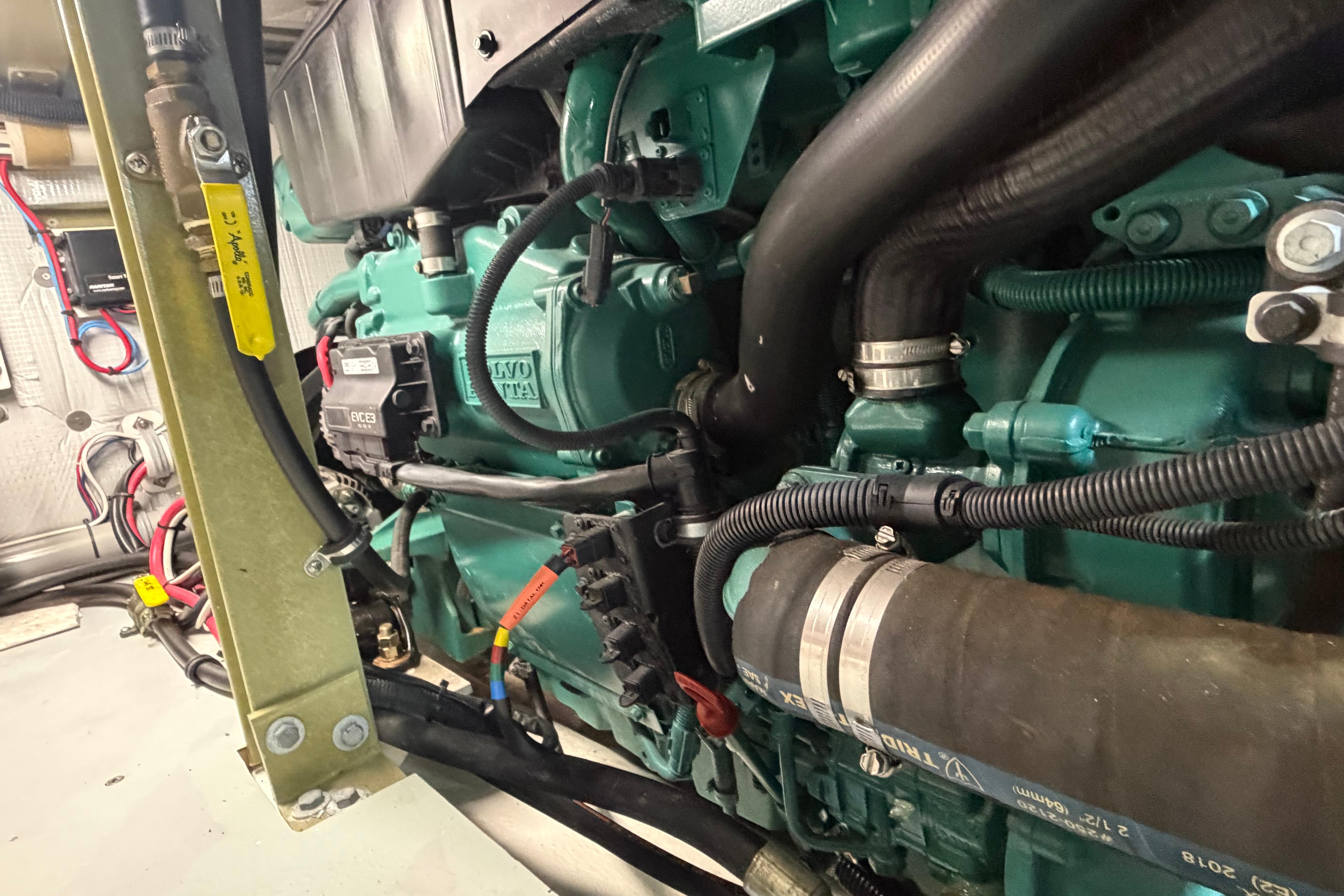 Engine compartment of a 2018 H&H Marine Osmond Beal boat, featuring Volvo Penta components.